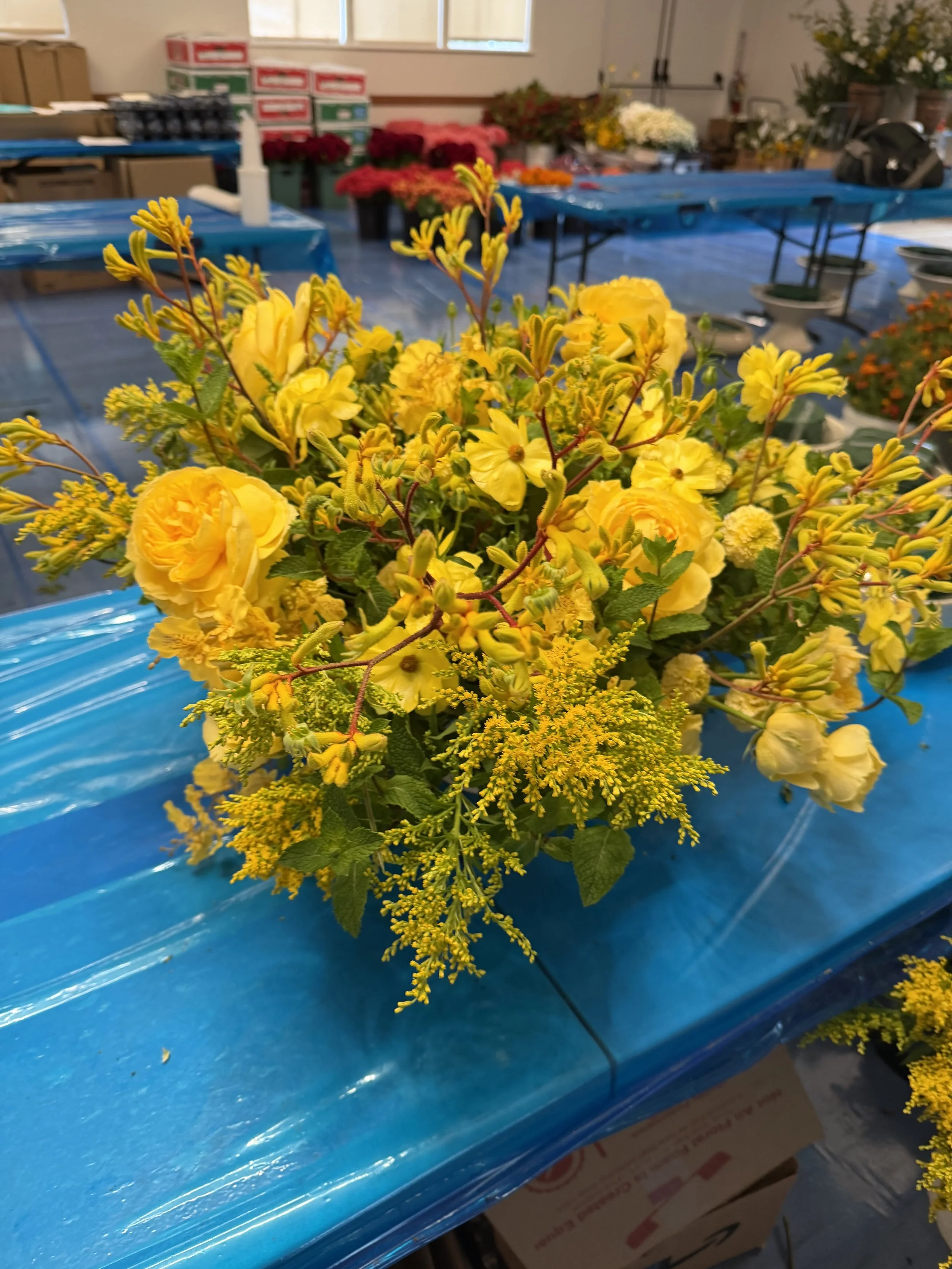 Bright yellow flower arrangement by The Strike Team Flowers in Concord, California