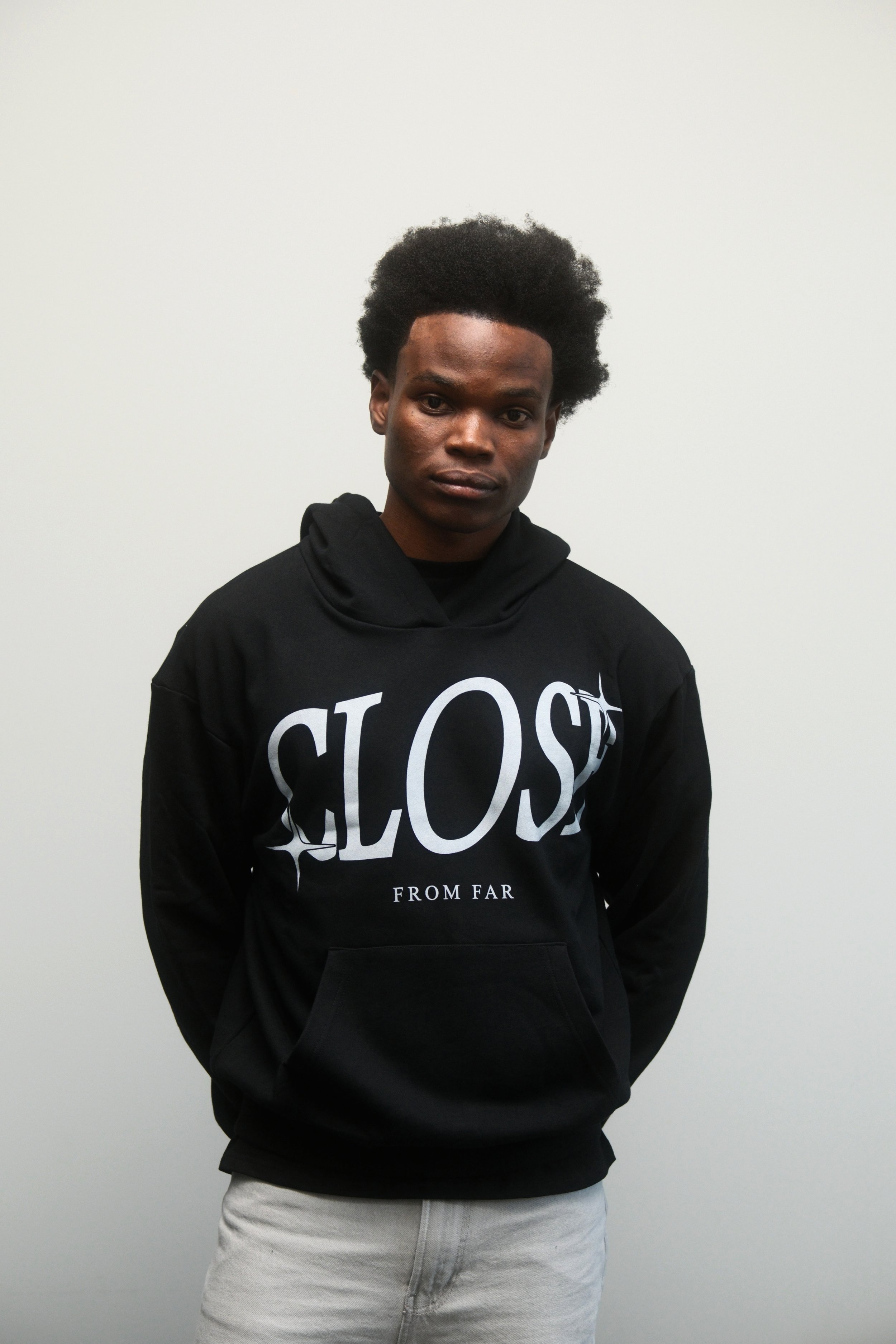 Male Model wearing a Two Stars Close From Far Black Hoodie