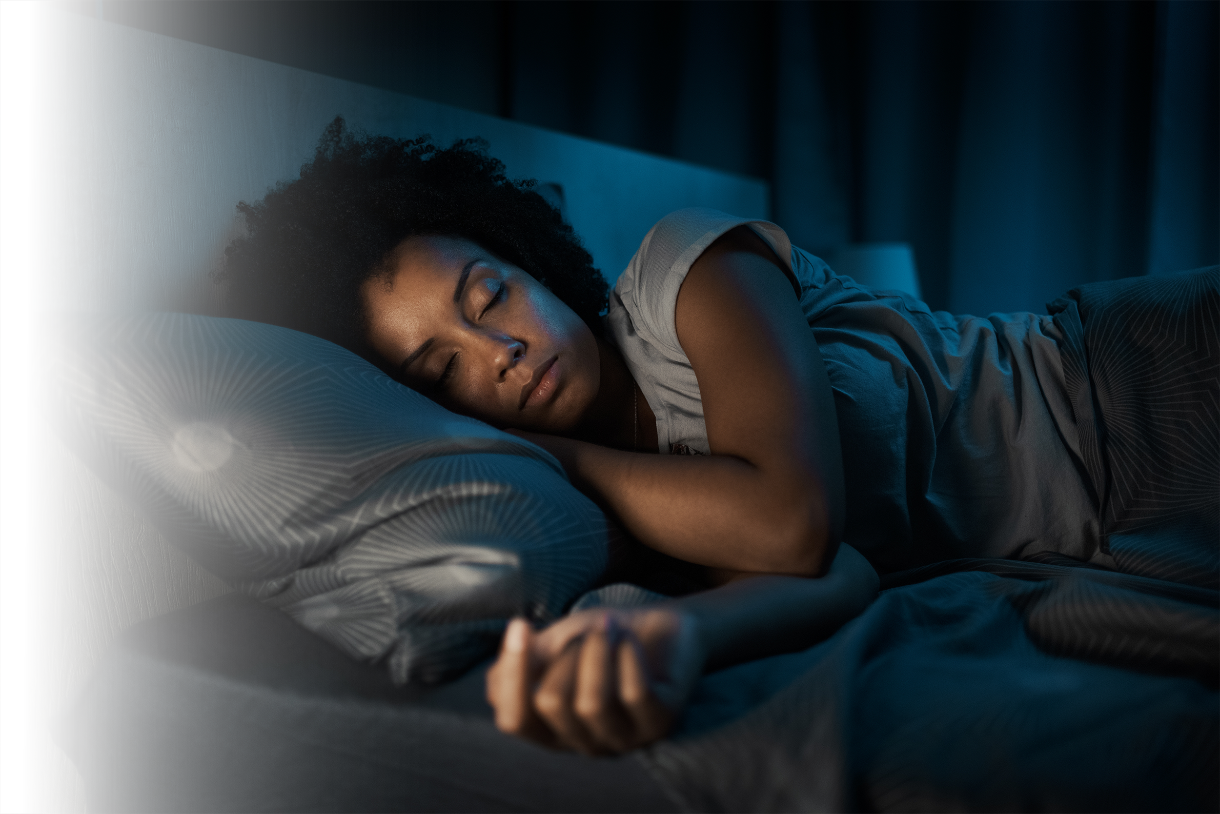 Image of an African American woman resting comfortably after sleep therapy