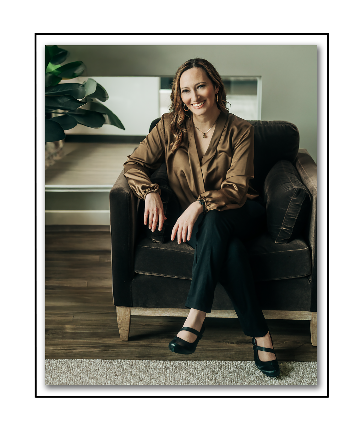 Dr. Noelle Balliett, sleep psychologist sitting in a chair