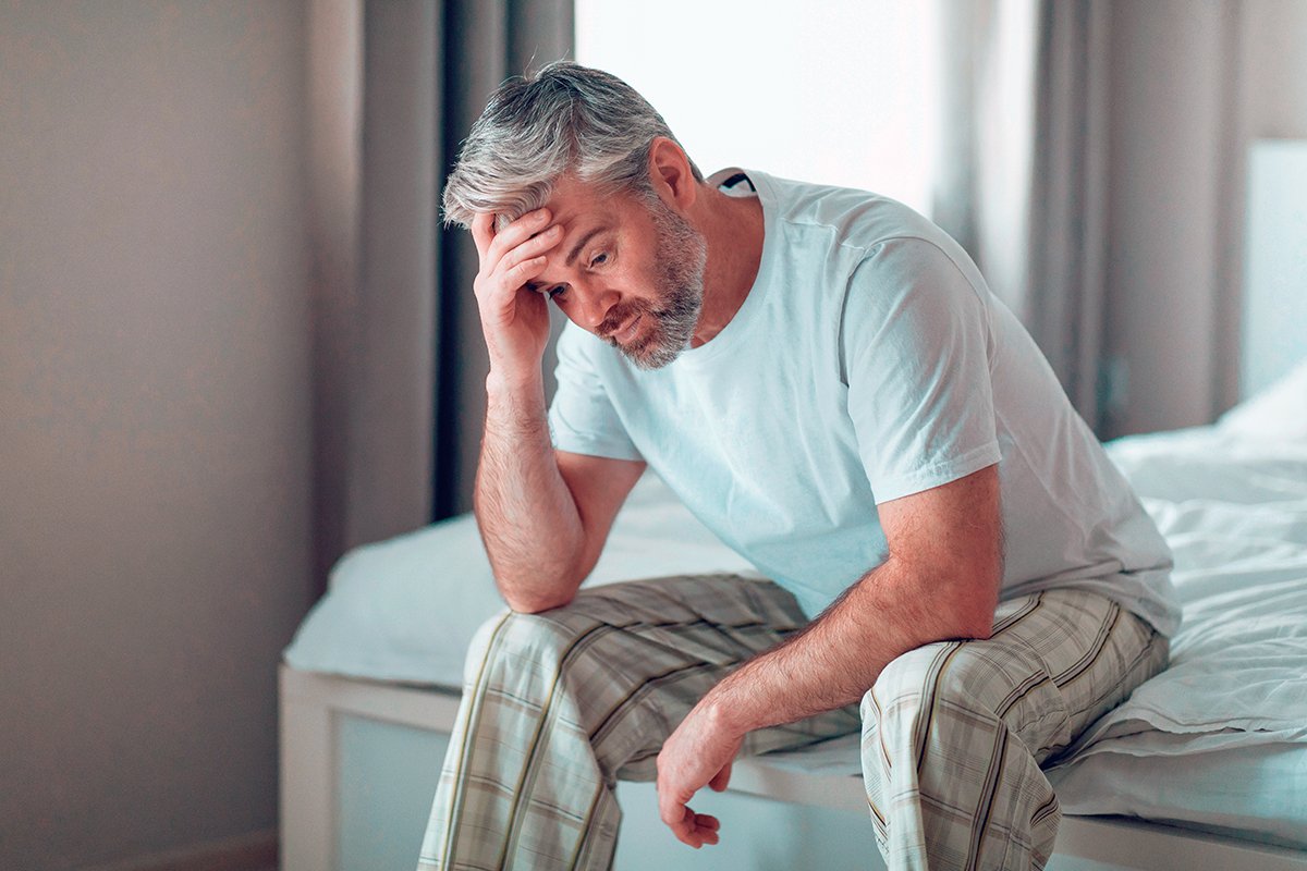 A middle aged man struggling with insomnia