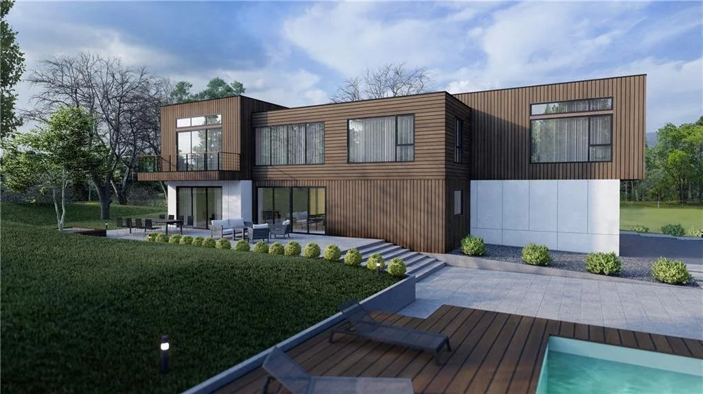 Modern two-story house with wooden paneling, large windows, and a minimalist design. The property includes a spacious patio, landscaping with shrubs, and a swimming pool in a landscaped backyard.