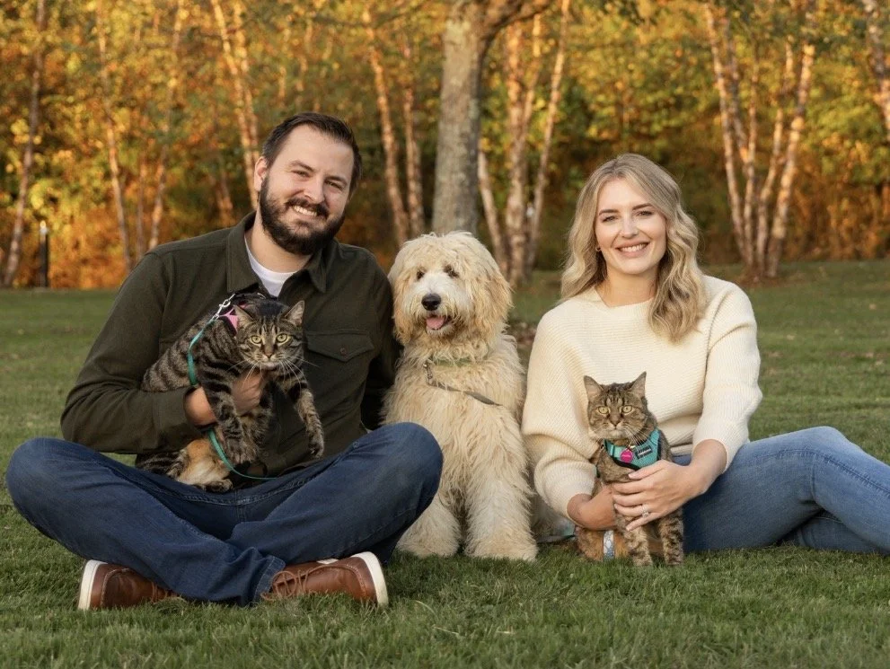 Picture of Dr. Vitunac with wife Kelly and their two cats and dog