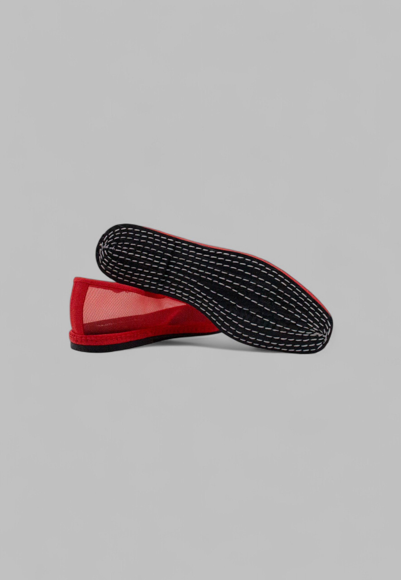 Underside of Aria flame slipper with hand-stitched rubber sole