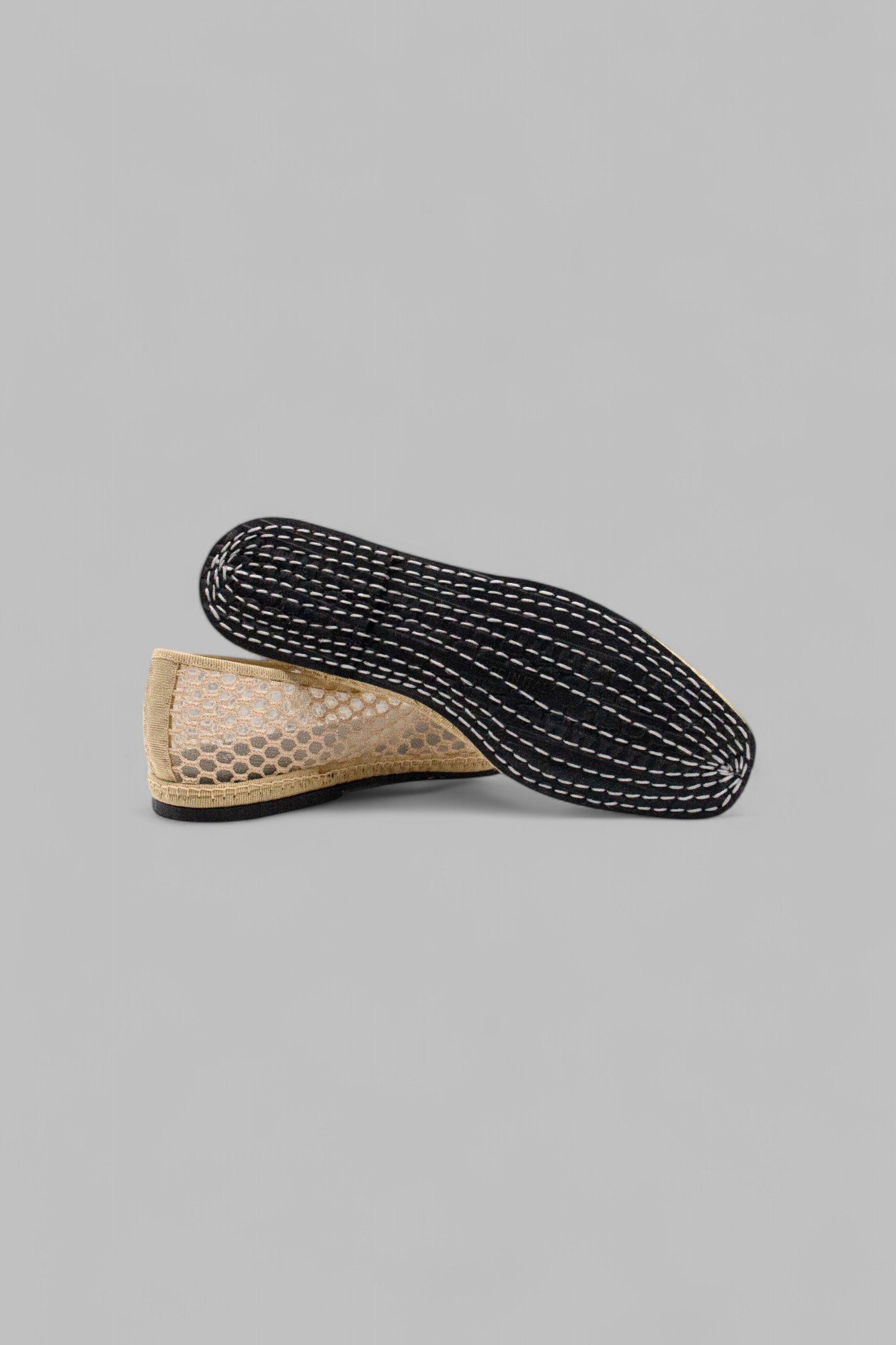 Underside of Aria Nude Net slipper with hand-stitched rubber sole
