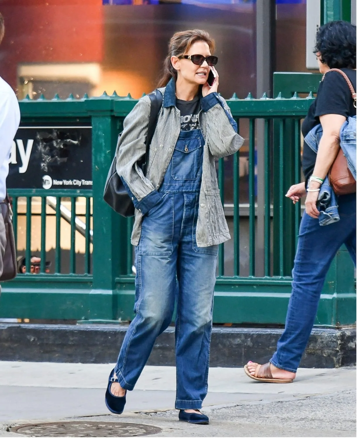 Katie Holmes in New York wearing blue velvet Friulane slippers with denim overalls, bridging Italian tradition with contemporary fashion. One of the celebrity spotted wearing this iconic shoe.