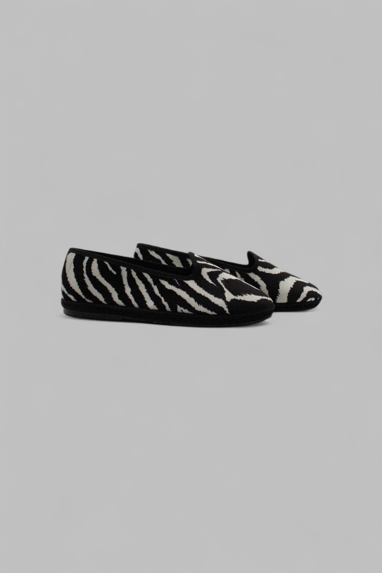 Side view of Gioia Zebra minimalist velvet slippers