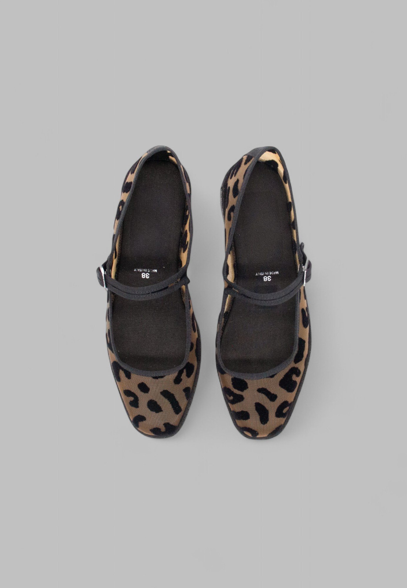 Top-down view of breathable jaguar print Aria flats with black trim