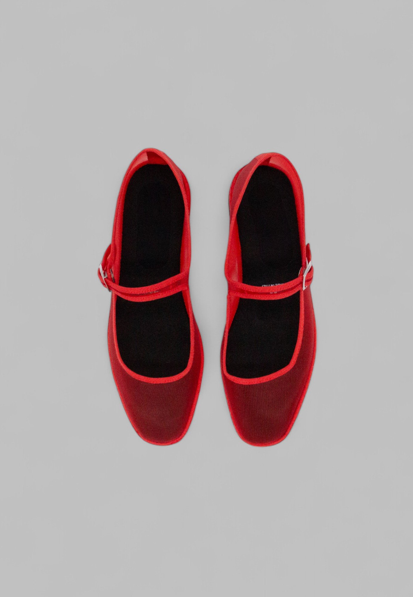 Top-down view of breathable mesh Aria flats with cotton trim