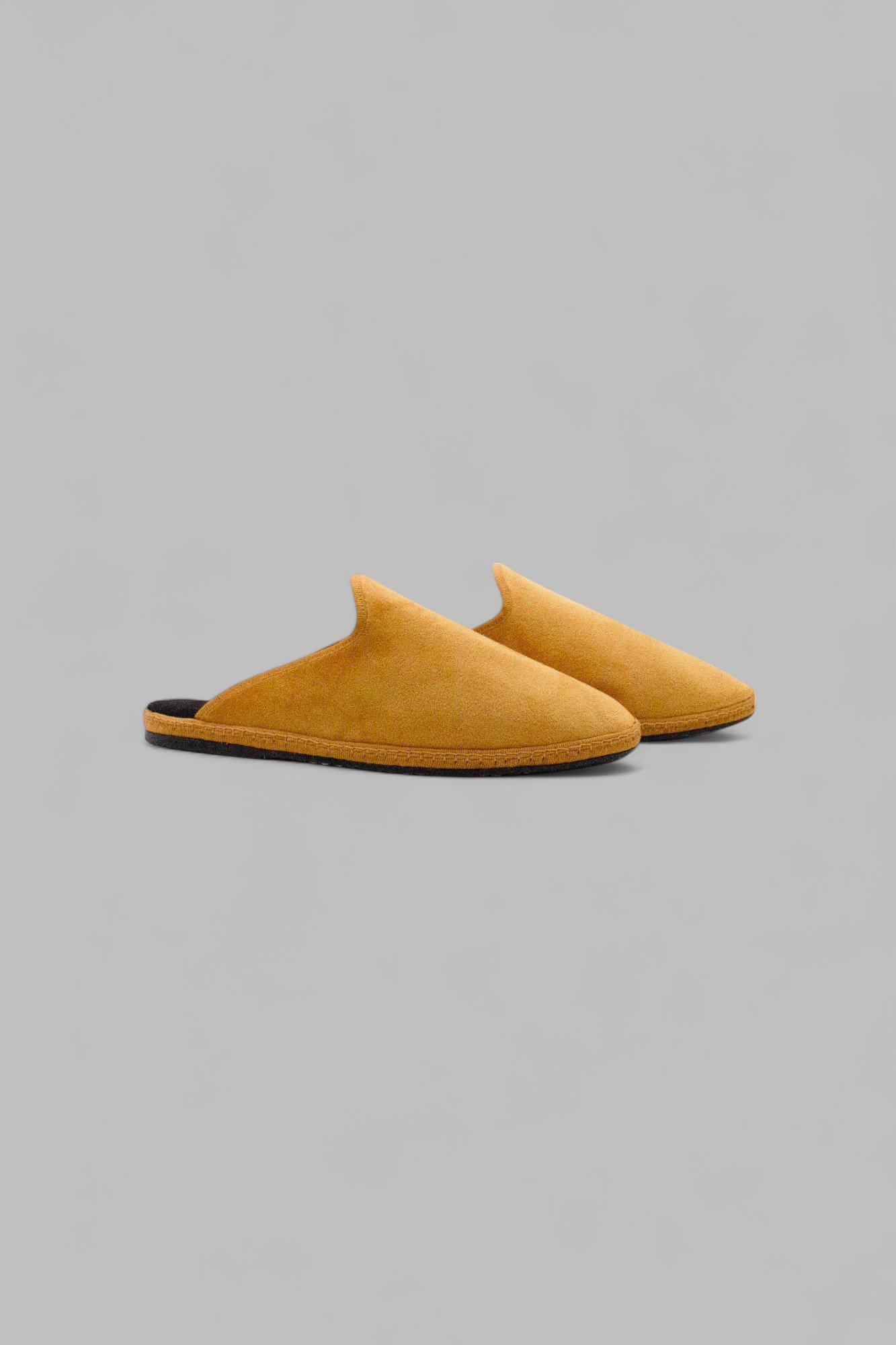 Side view of Solea velvet mule pair in sunny yellow