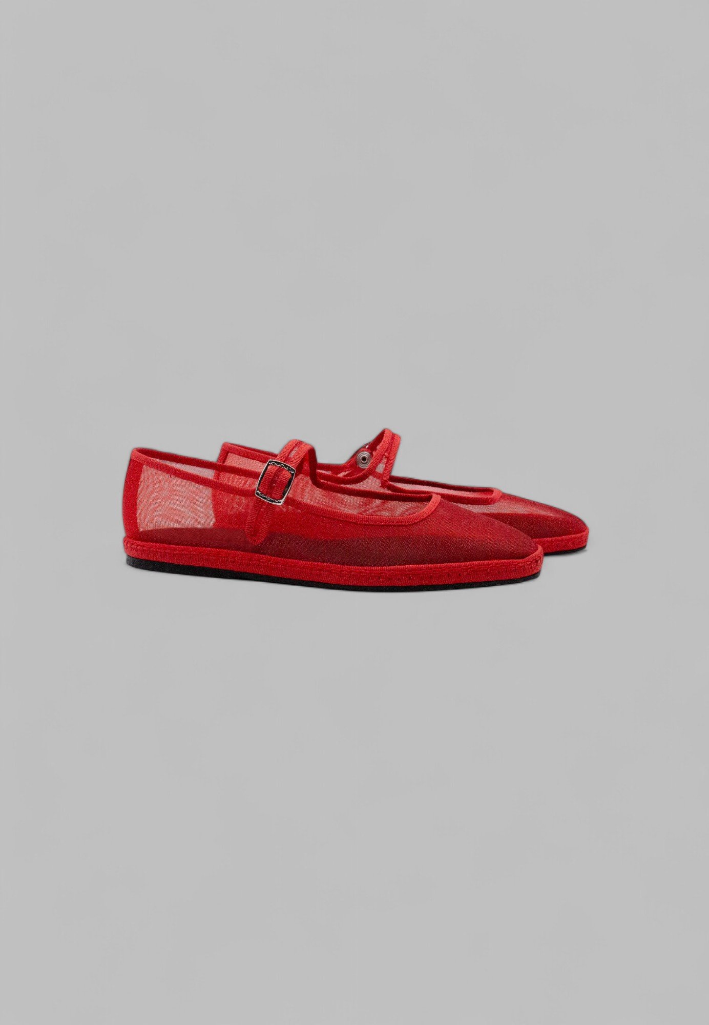 Side view of flame-red mesh Mary Jane Friulana shoe pair