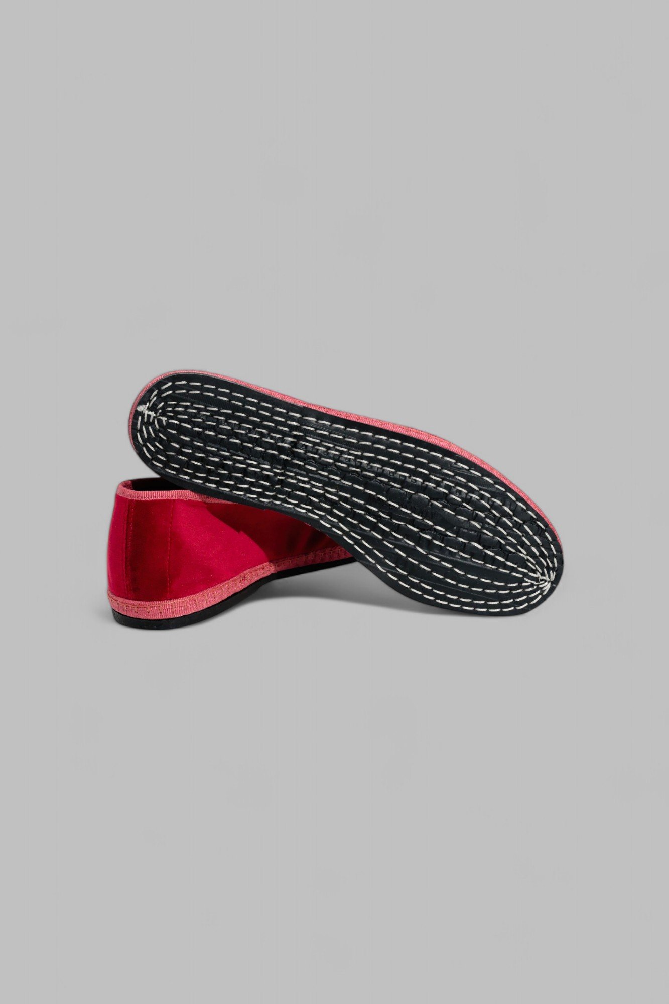 Underside of Gioia slipper showing traditional stitched rubber sole