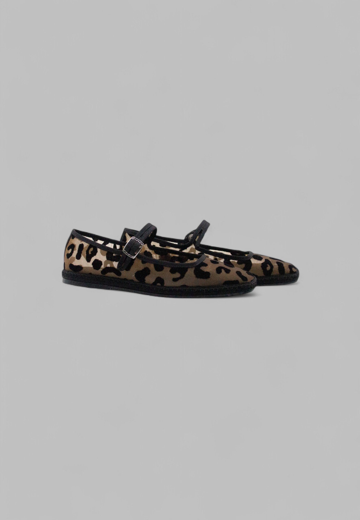 Side view of jaguar print mesh Mary Jane slipper pair