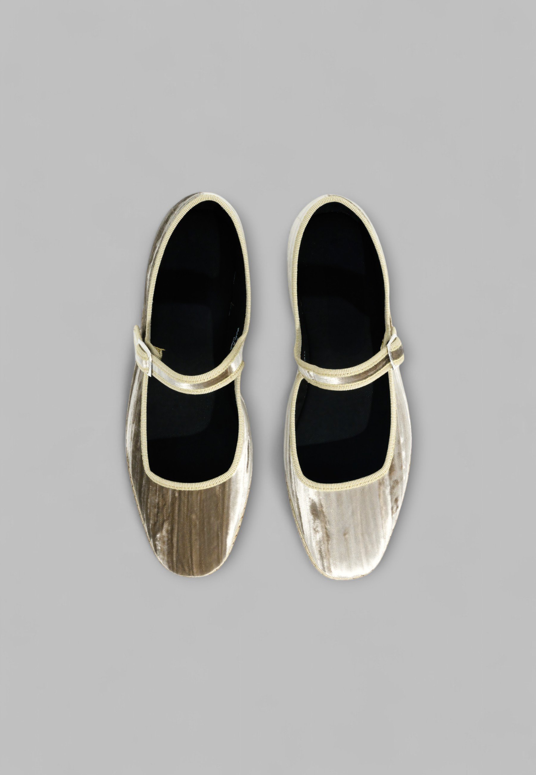 Top view of Champagne Mary Janes with silver color buckle visible and black cotton lining inside