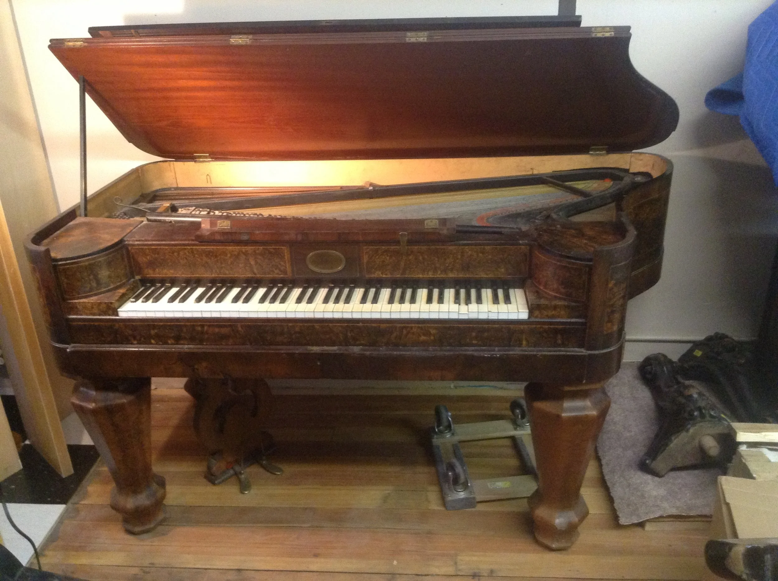 Extremely rare 1830s/1840s Andrew Reuss bent-side square made in Cincinnati Ohio. Possibly the only one in existence and completely original. This incredible little piano has a Viennese action, unwound brass stringing in the bass, and a second soundb