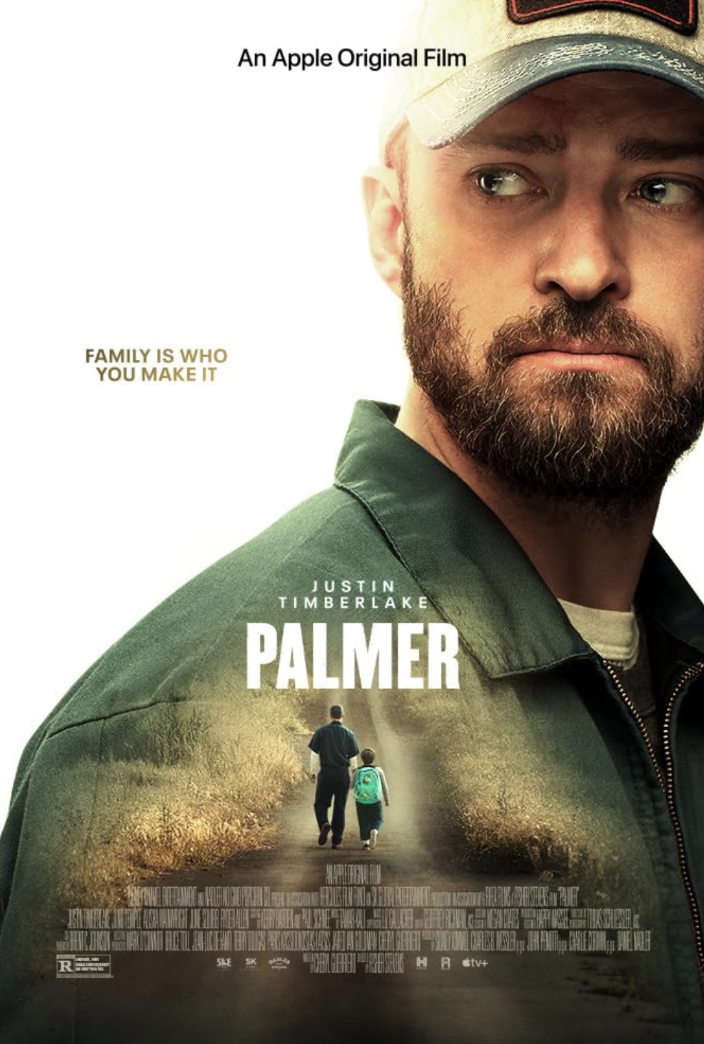 Movie poster for 'Palmer' featuring a close-up of a man with a beard and cap, with a smaller image of a man and a child walking on a dirt road with grass on either side.