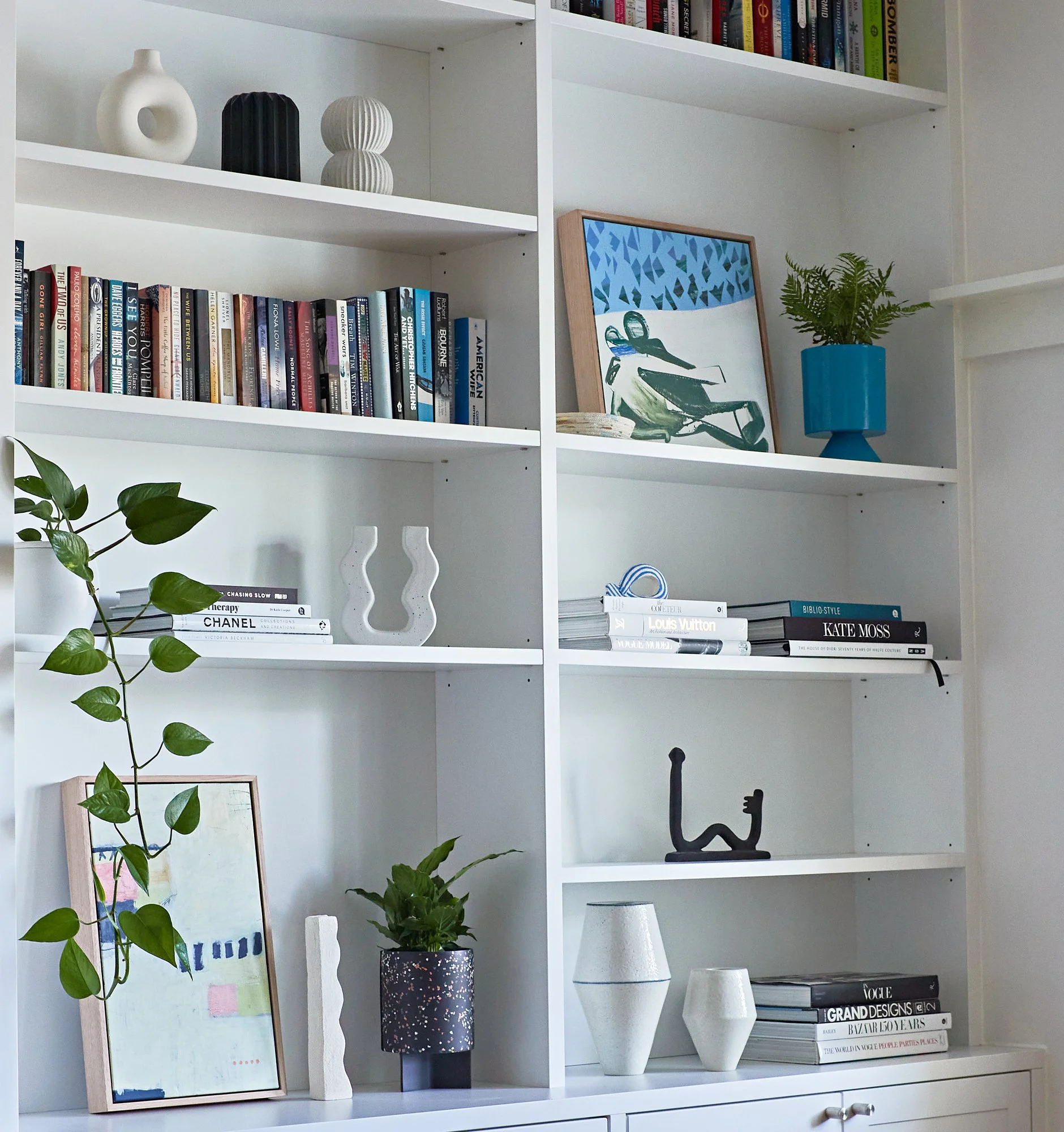 Close-up of the floor-to-ceiling custom shelving and display joinery at Adella Court, Elwood.