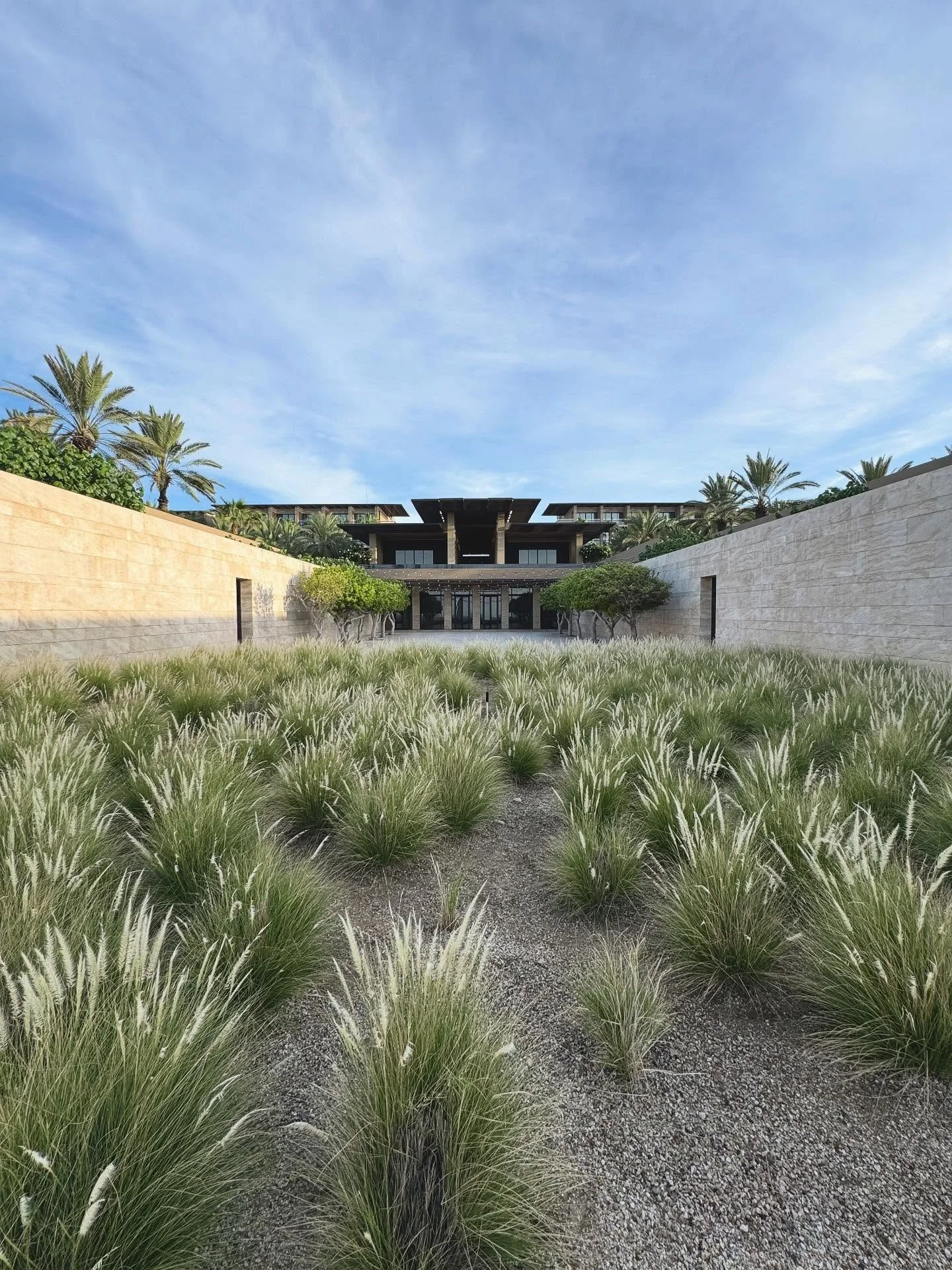 Without imposing itself, this hotel dramatically frames the surrounding nature with warm desert tones of wood, steel, and travertine while layered reflecting pools lead your eyes to the ocean. 
Although it&rsquo;s not quite the raw and exposed art of