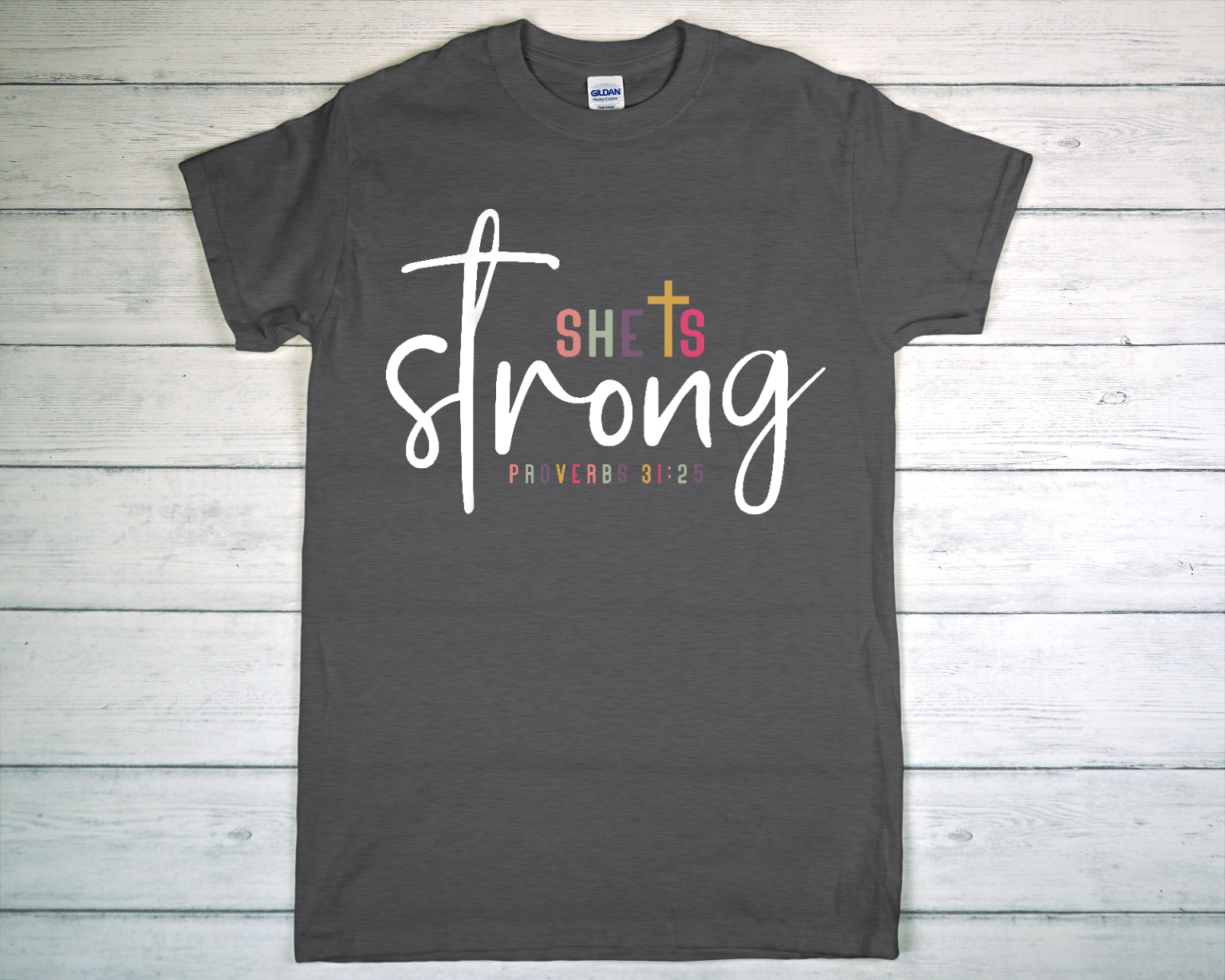 Charcoal Gray Short-Sleeved T-Shirt on White Wooden Surface.png