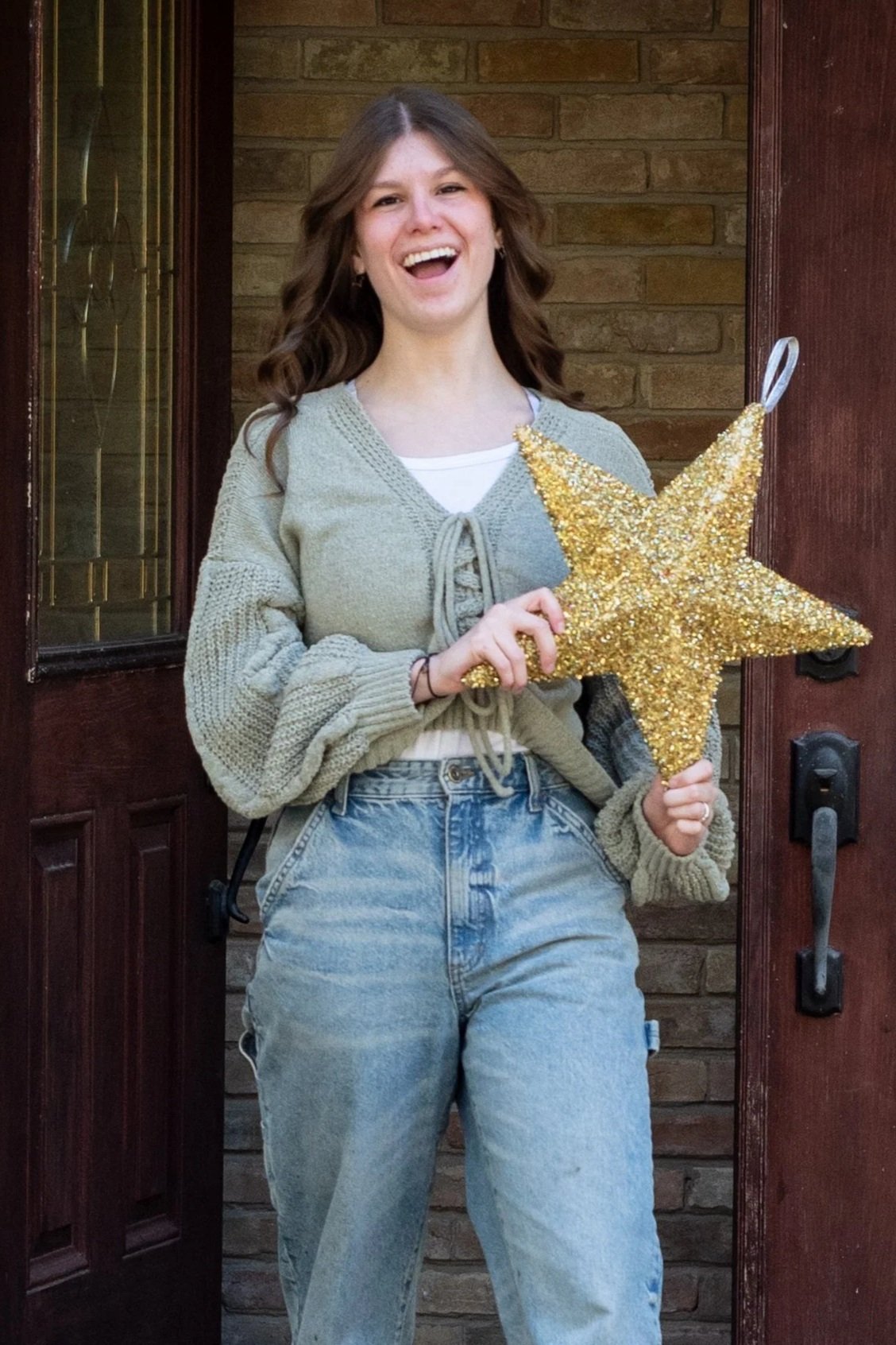 Kendall Arnold Walking out of door with Star