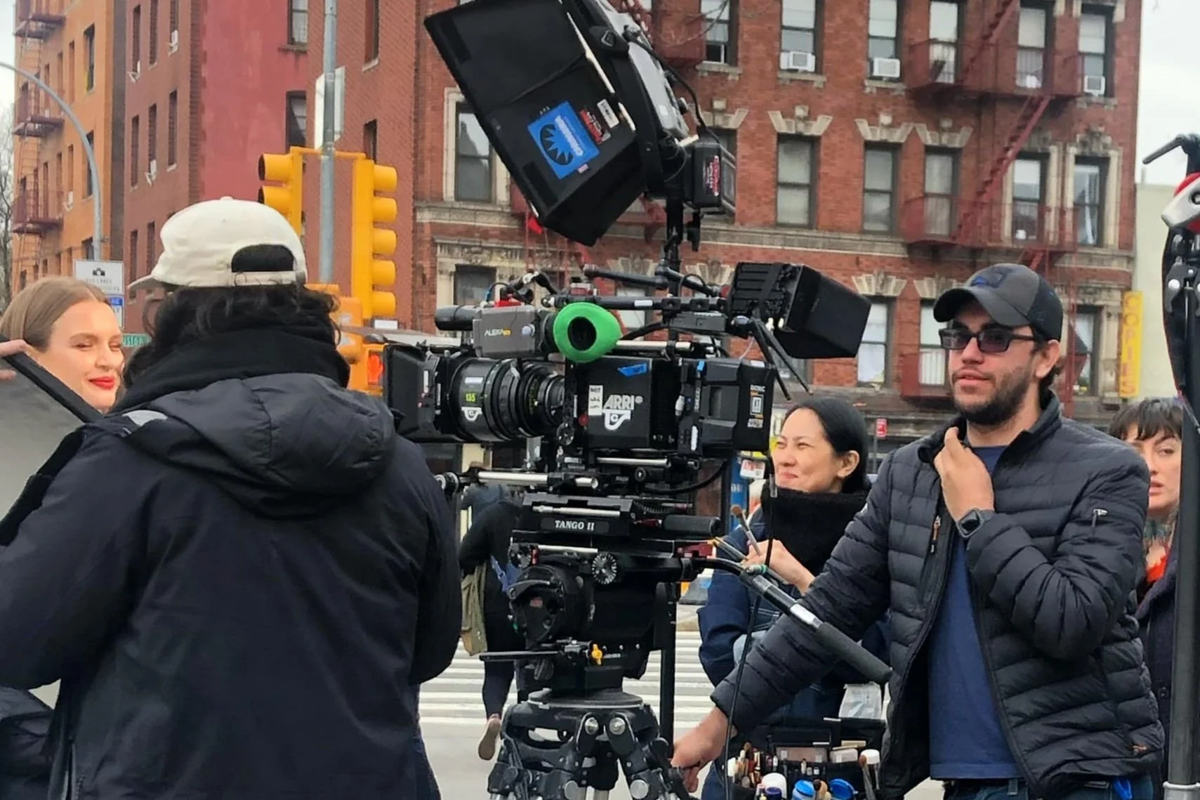 Film crew with professional camera on city street