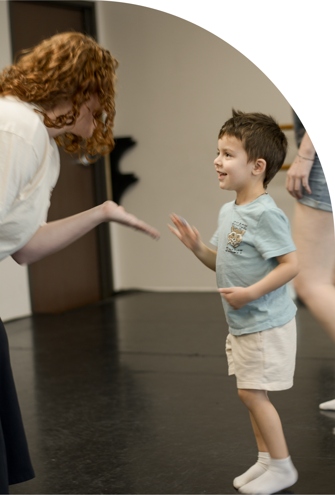 studio j teacher giving high five to a preschool dancer in brea dance studio