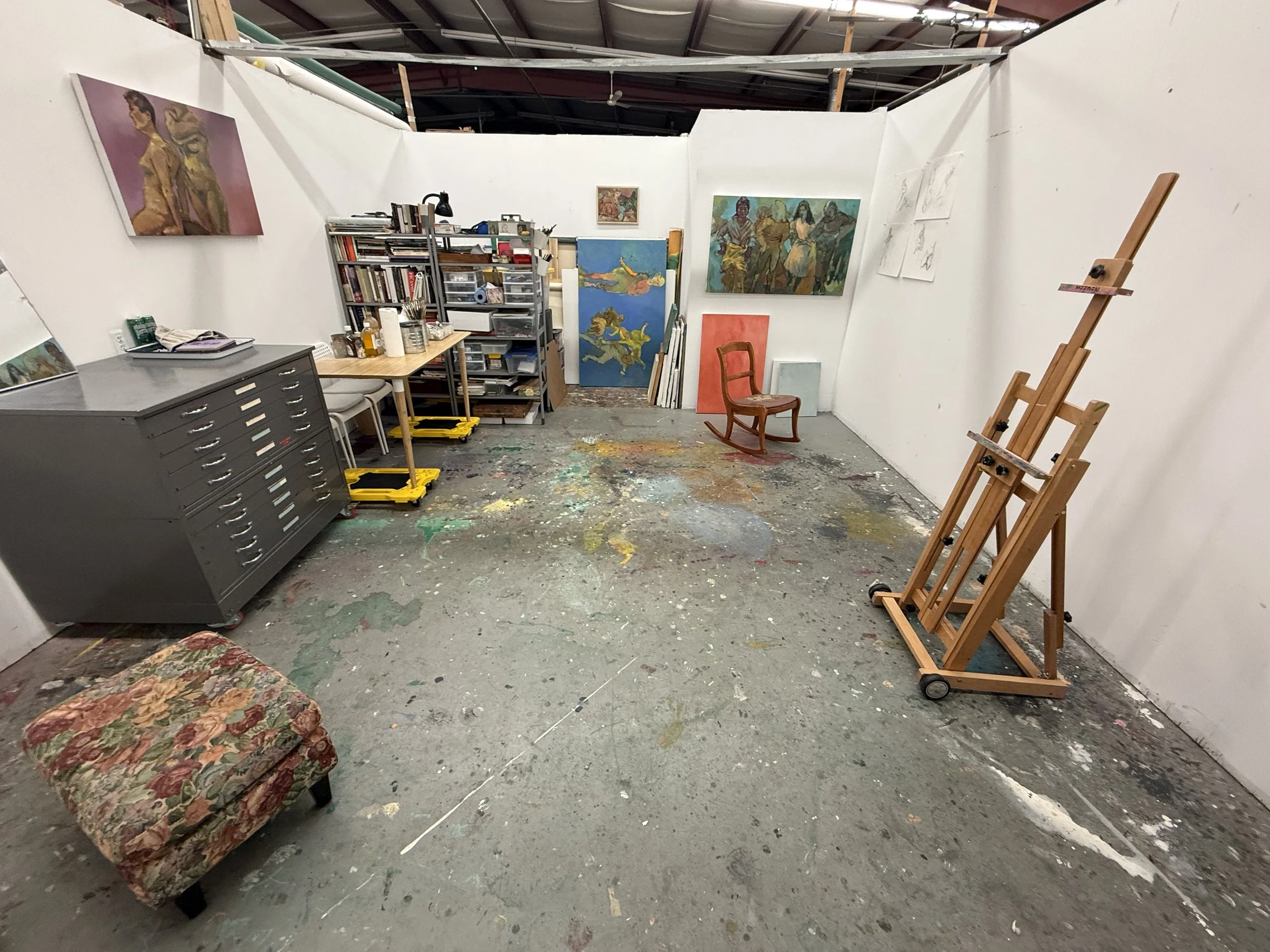 View of V. A. Stusiak’s Edmonton studio with paintings, art materials, and works in progress.