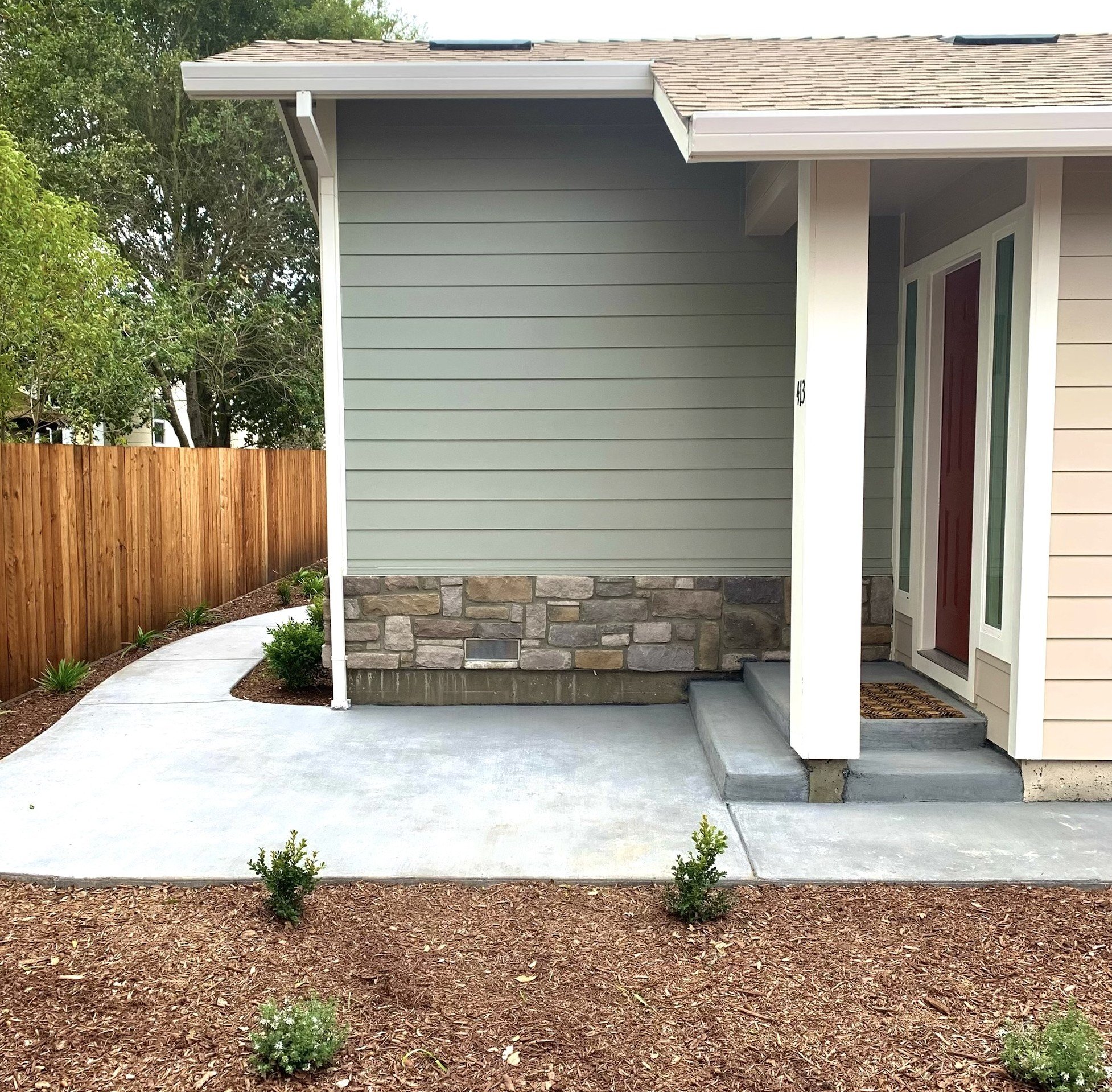 Smooth concrete patio with clean lines and modern finish – installed by Novara Landscape in Sonoma County