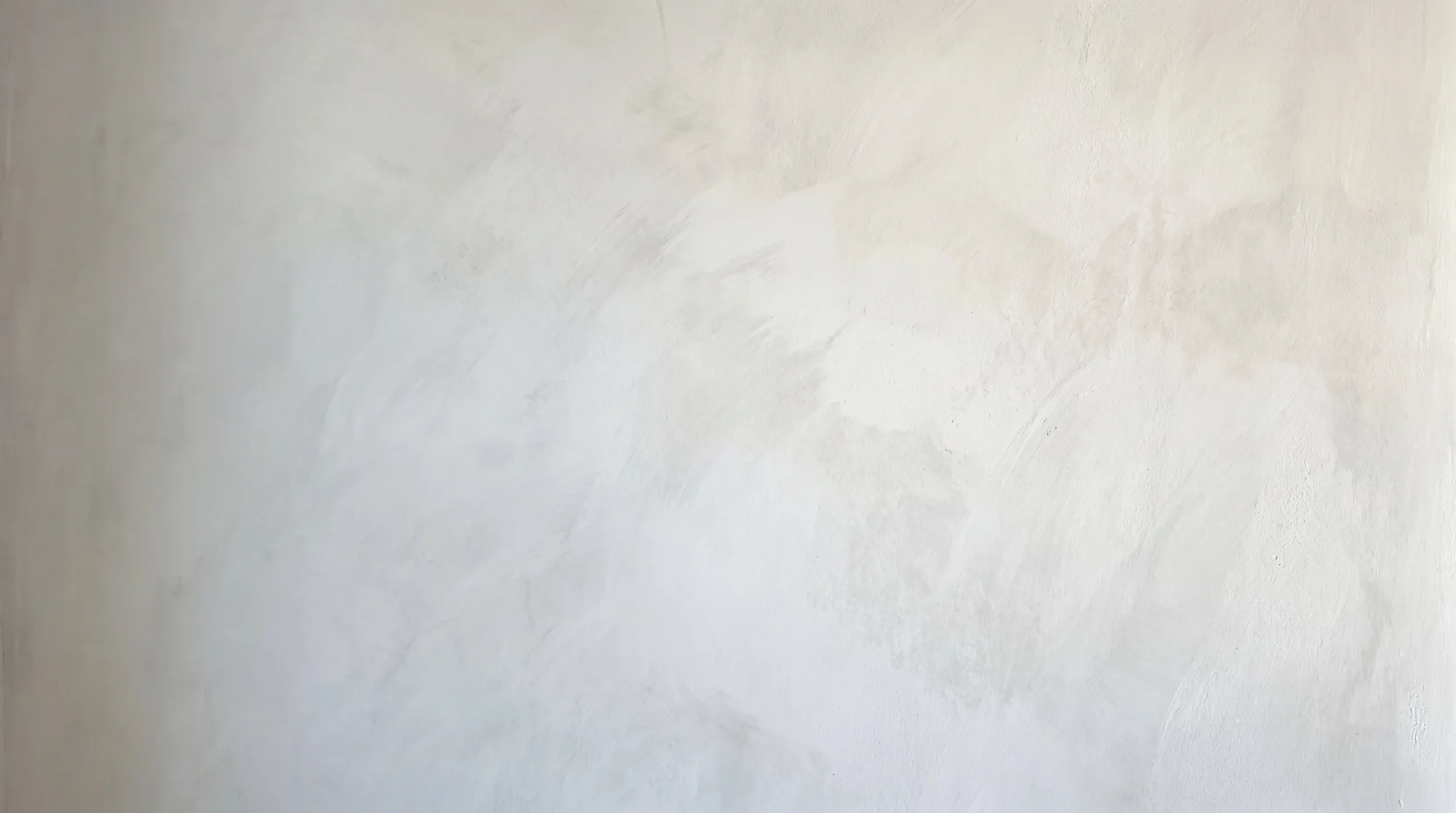 Limewash wall texture in soft raking light — lime wash painting in Auckland by Key Painting