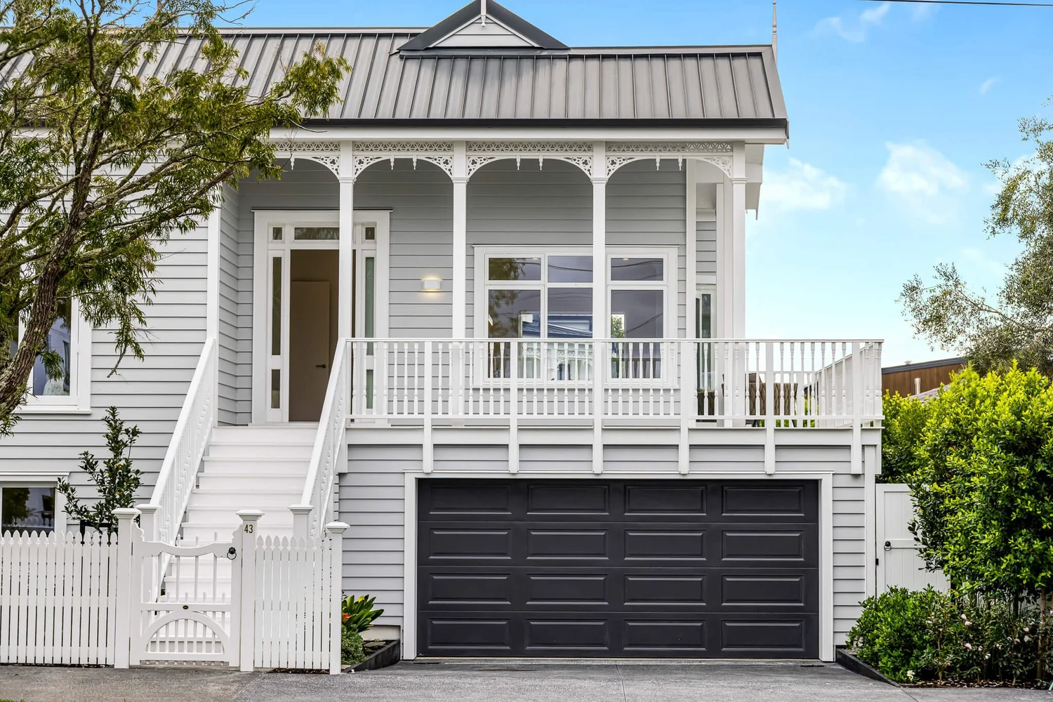 White weatherboard home exterior repainted before auction, Auckland