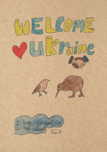Colorful hand-drawn sign that says 'WELCOME Ukraine' with a red heart and a handshake illustration. Drawings of a bird and a wombat. A blue cloud with a message: 'I hope you have fun in New Zealand!'