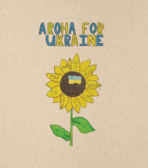 Child's drawing of a sunflower with a black center, a blue and yellow Ukrainian flag inside the center, and yellow petals with handwritten words. The text above the flower reads 'Aloha for Ukraine.'
