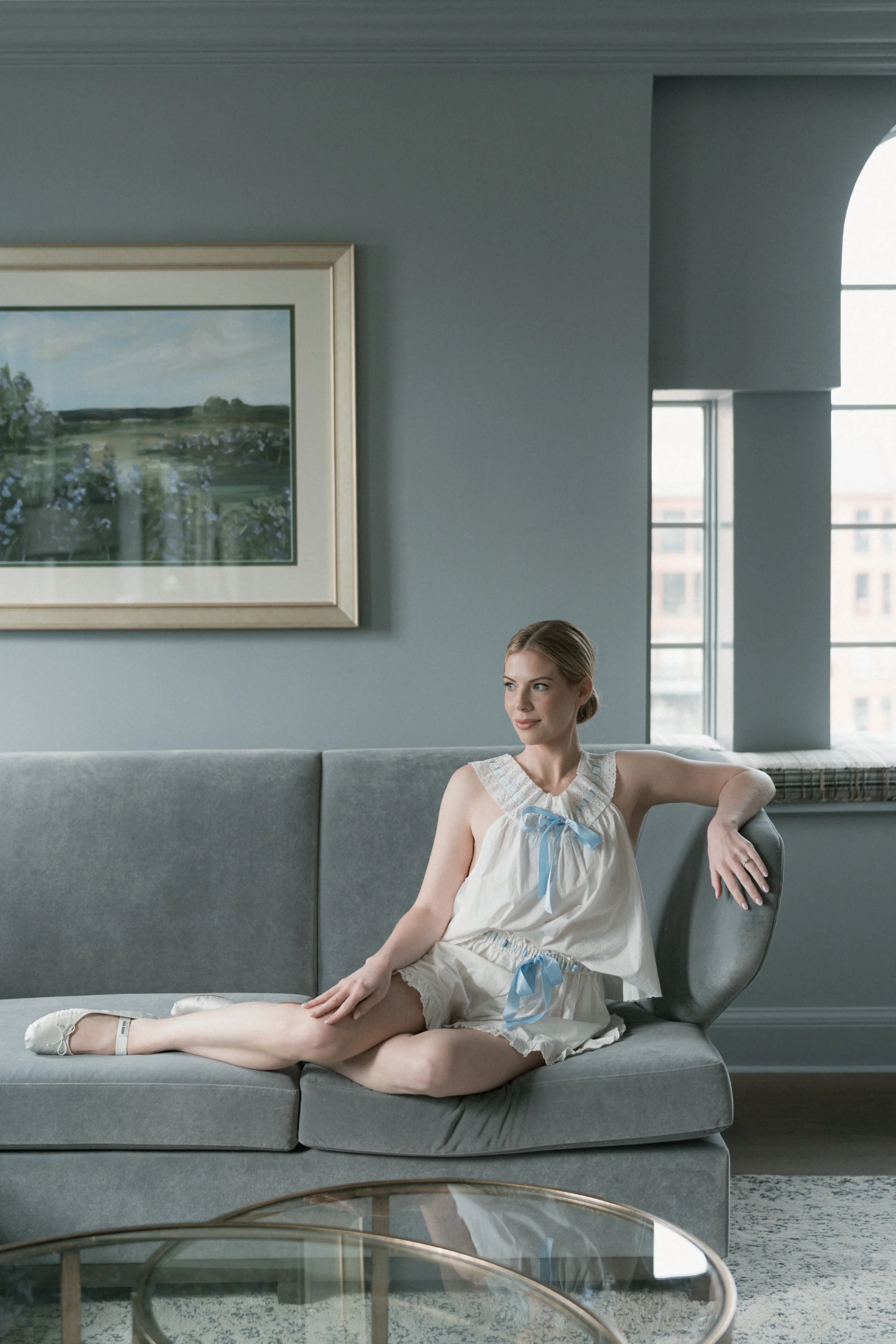 Bride getting ready for her wedding day wearing matching set and Miu Miu flats.