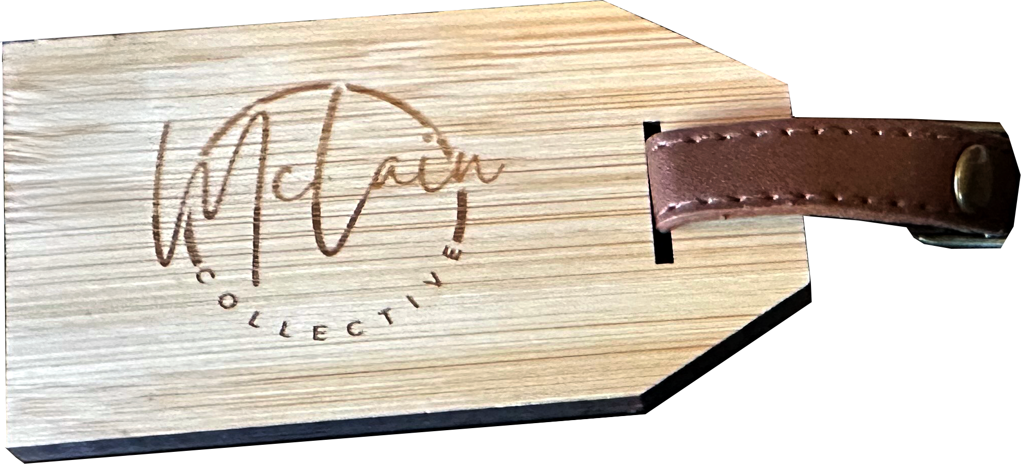 A wooden tag with 'McLain Collection' engraved on it, attached to a brown leather strap with a brass rivet.