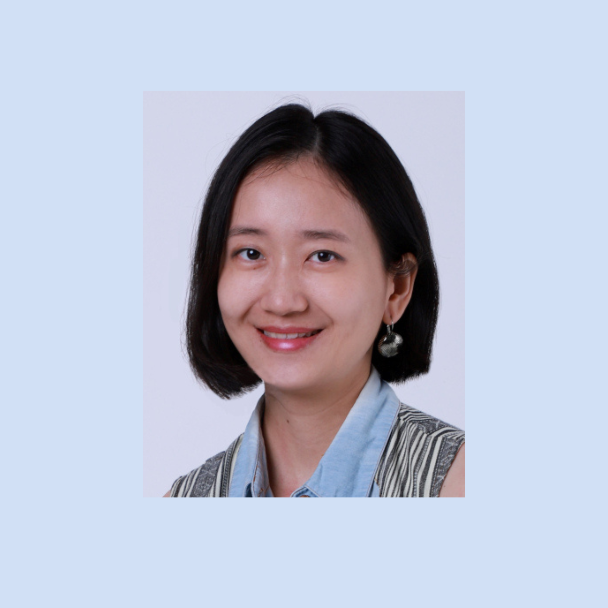 Portrait of Mindy Ong, Deputy Director at Singapore’s Ministry of Social and Family Development, smiling against a neutral background.