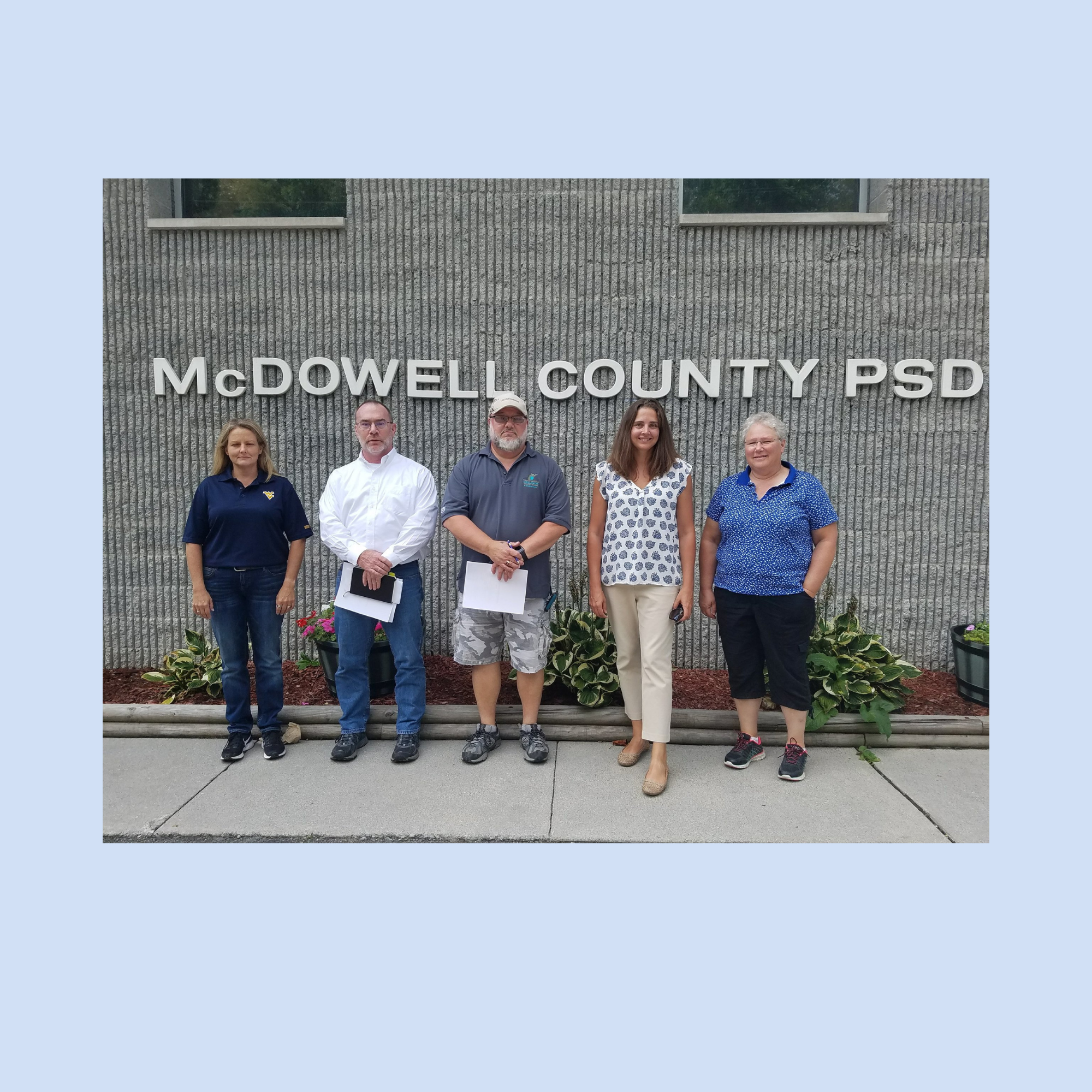 AWTC partners and community stakeholders standing outside McDowell County Public Service District building in West Virginia