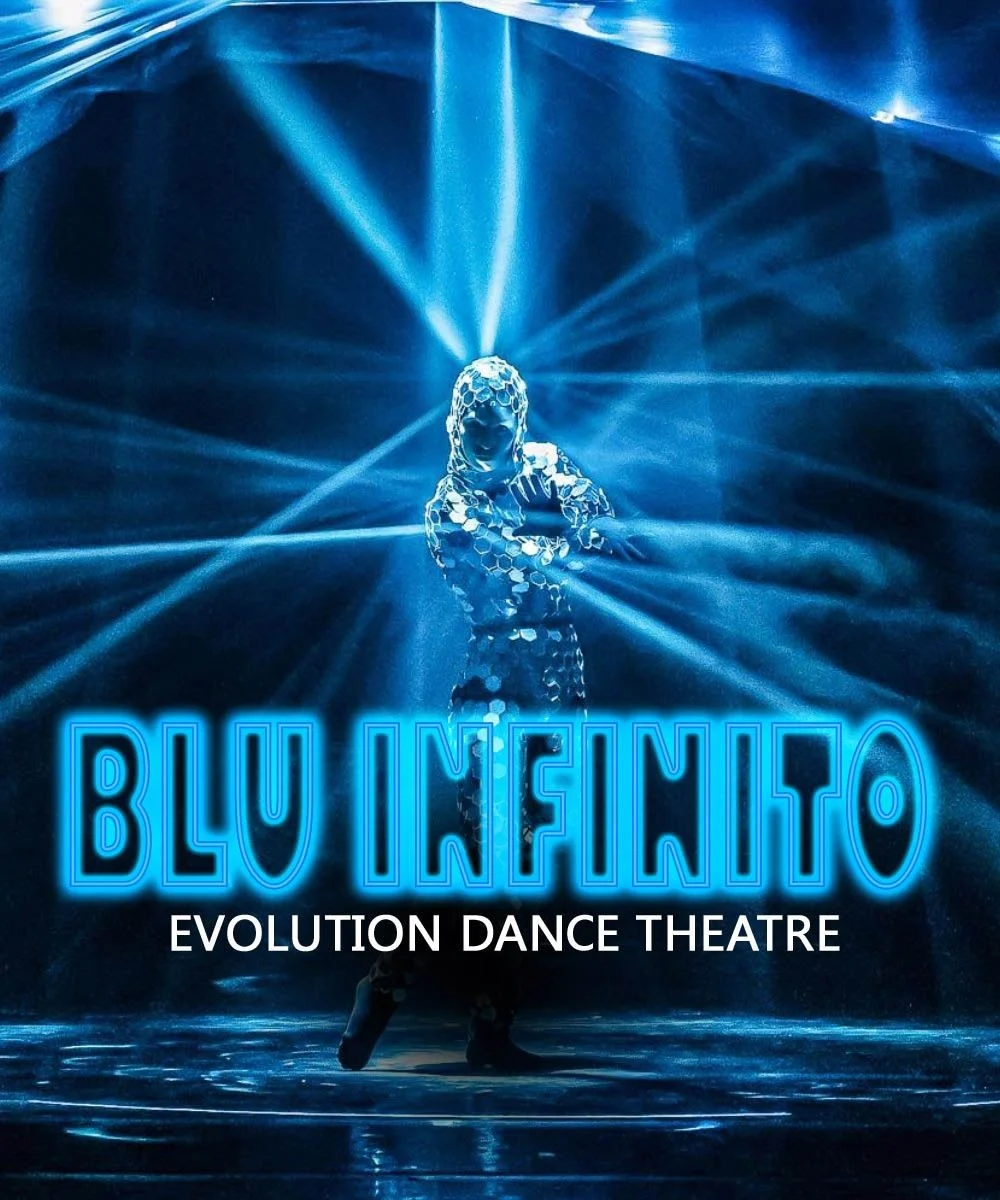 A performer dressed in a reflective outfit stands under blue stage lights with text reading 'Blu Infinito Evolution Dance Theatre.'