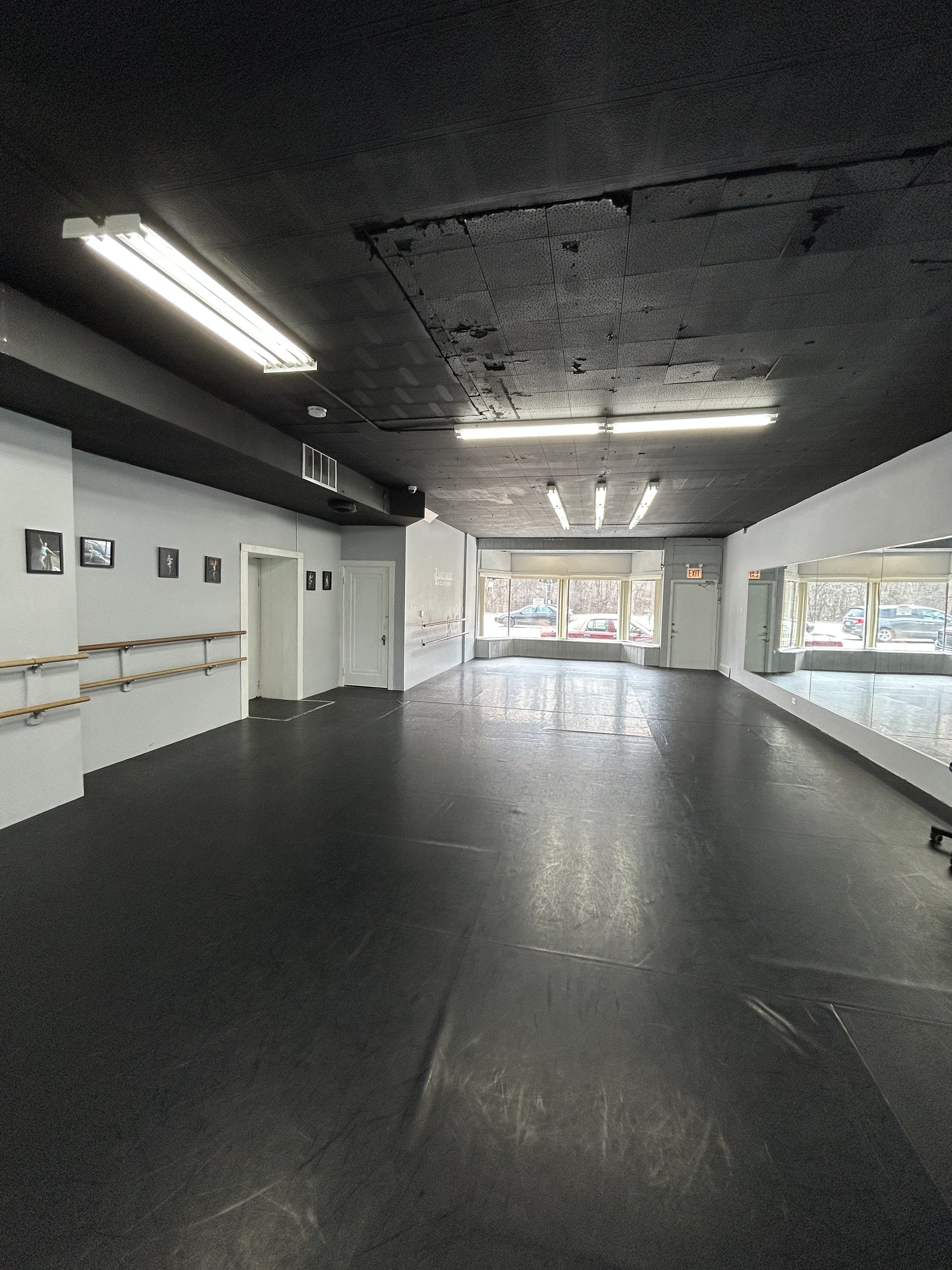 1800 sq ft (60’x30’) | black marley floors | portable center barre | one wall of barres | one wall of large windows and natural light | stereo system | private bathroom