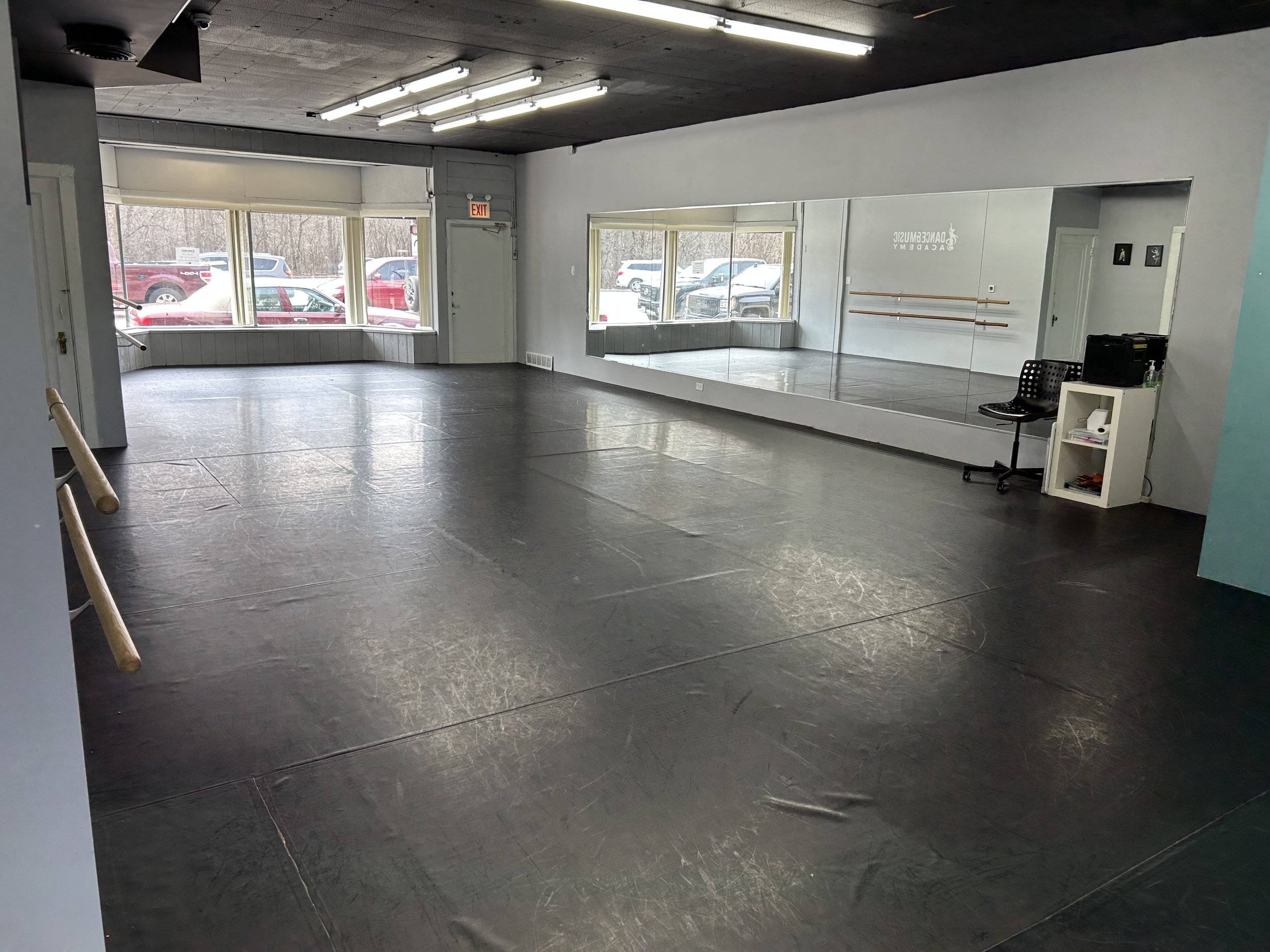 1800 sq ft (60’x30’) | black marley floors | portable center barre | one wall of barres | one wall of large windows and natural light | stereo system | private bathroom