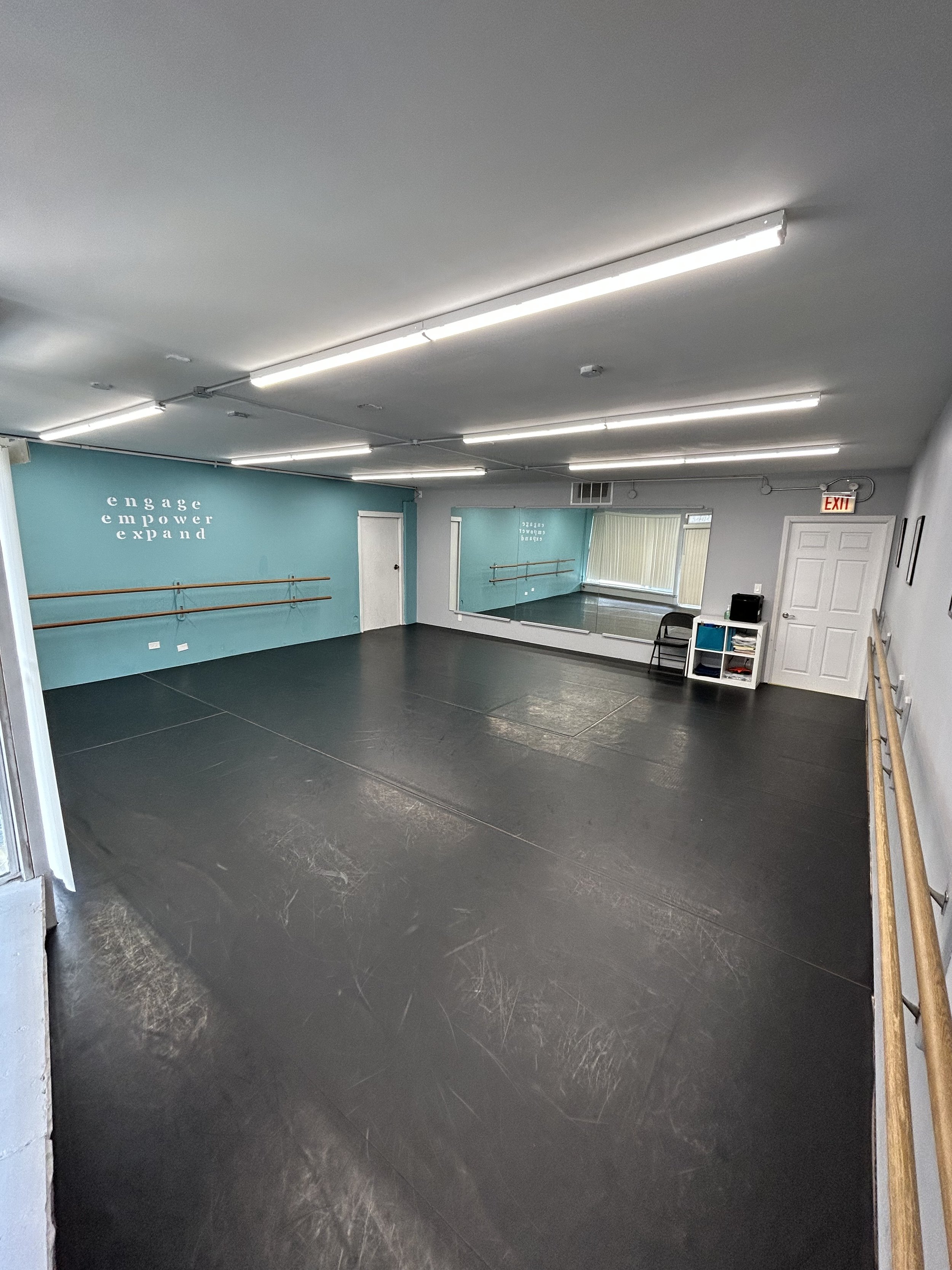 625 sq ft (25’x25’) | black marley floors | two wall of barres | one wall of large windows and natural light | stereo system |