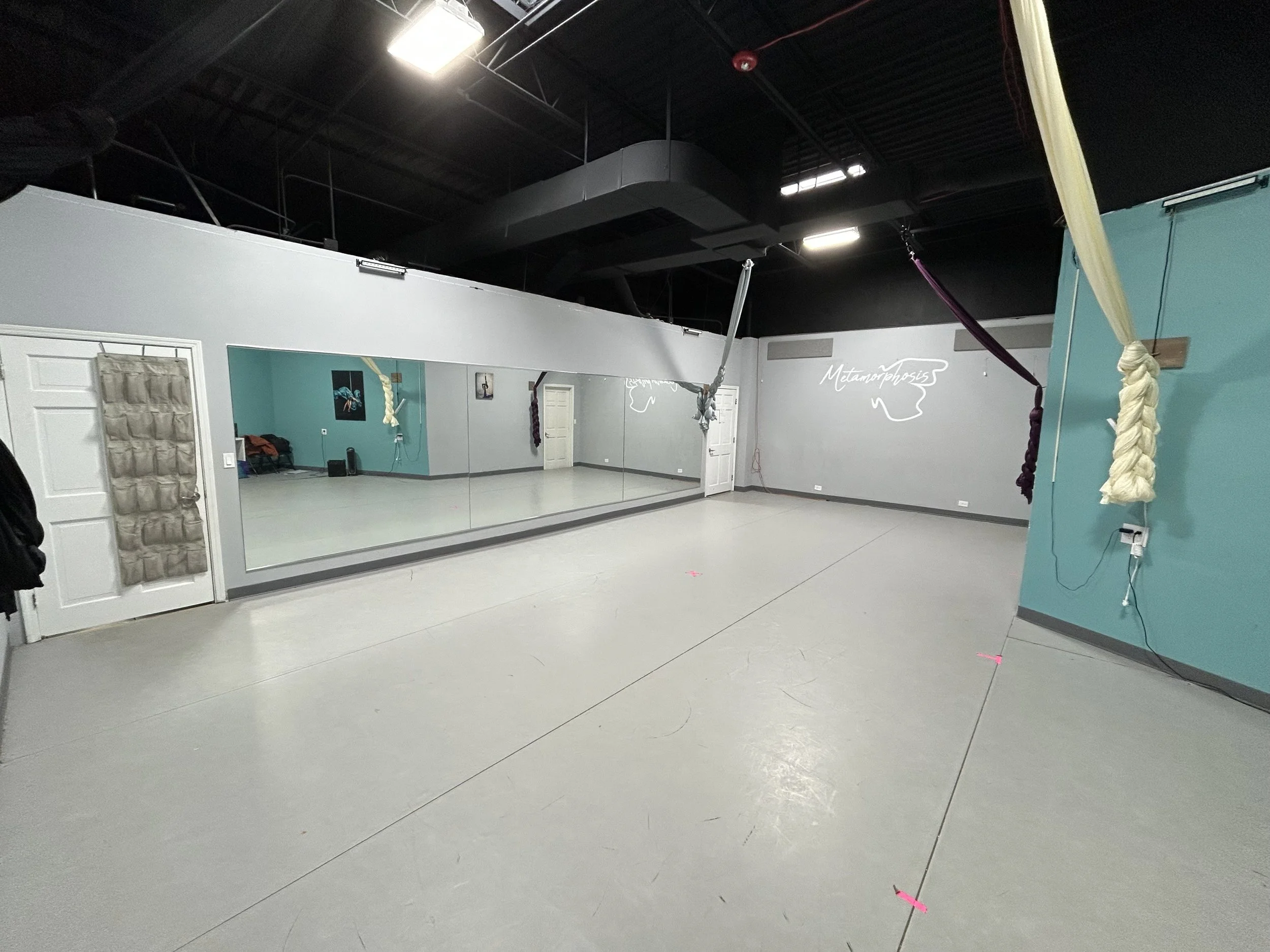 600 sq ft (33’x30'- front wall, 33'x18' half wall) | marley floor | 4 silks, rigging ladder | stereo system