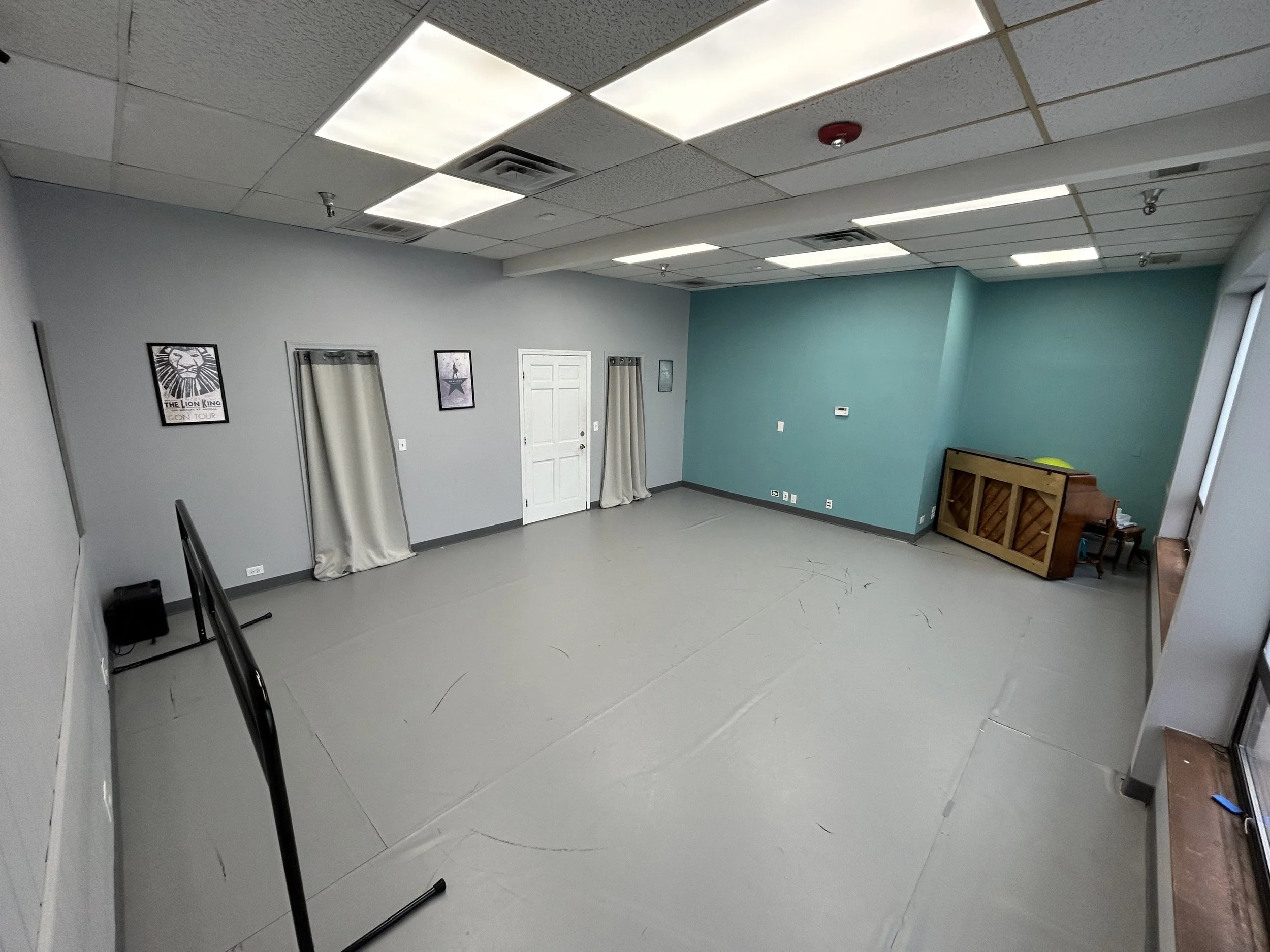 374 sq ft (17’x22’) | marley floor | portable center barre | one wall of large windows | stereo system