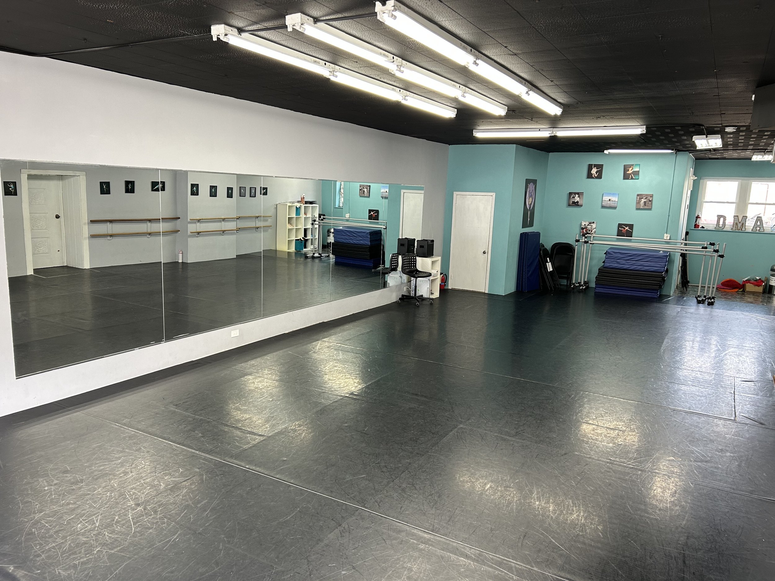 1800 sq ft (60’x30’) | black marley floors | portable center barre | one wall of barres | one wall of large windows and natural light | stereo system | private bathroom