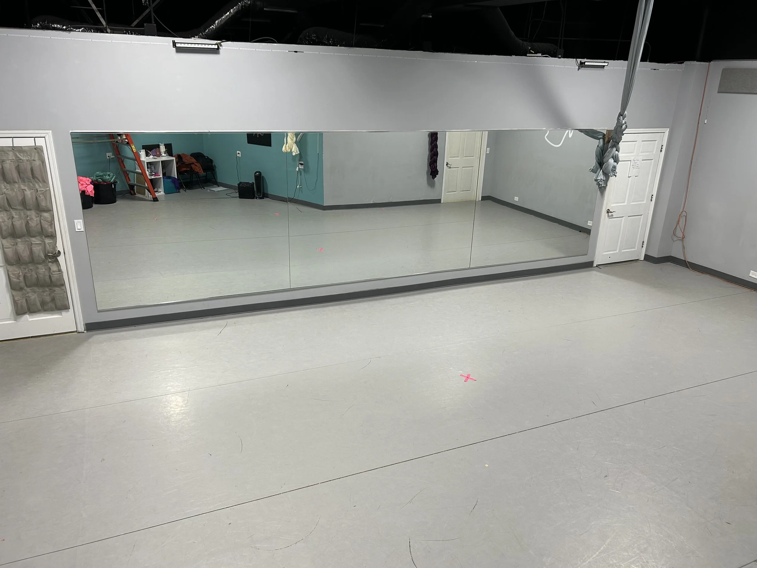 600 sq ft (33’x30'- front wall, 33'x18' half wall) | marley floor | 4 silks, rigging ladder | stereo system