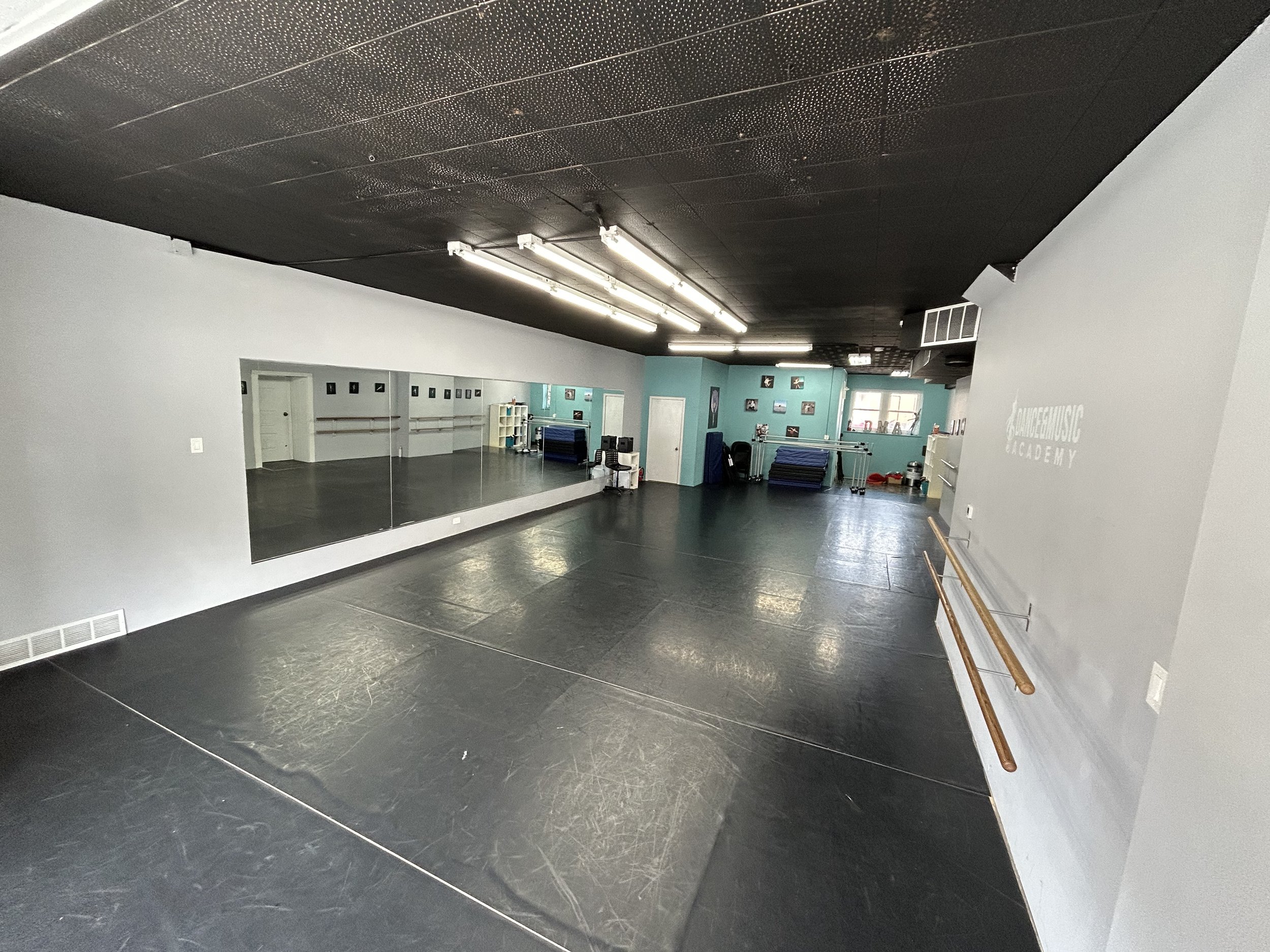 1800 sq ft (60’x30’) | black marley floors | portable center barre | one wall of barres | one wall of large windows and natural light | stereo system | private bathroom