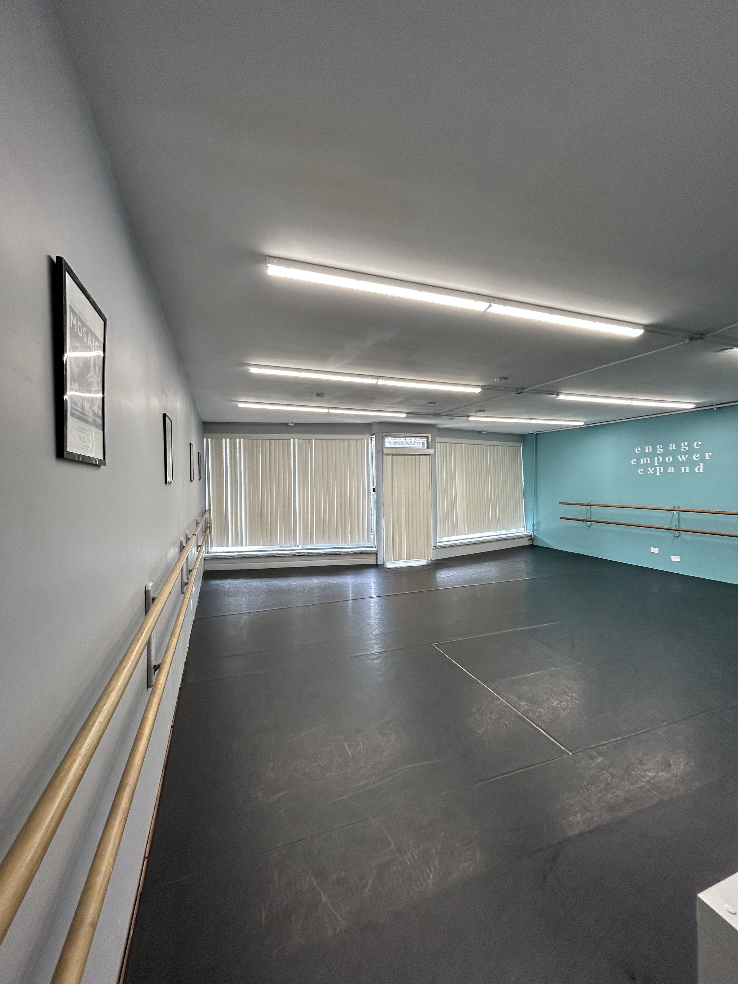625 sq ft (25’x25’) | black marley floors | two wall of barres | one wall of large windows and natural light | stereo system |
