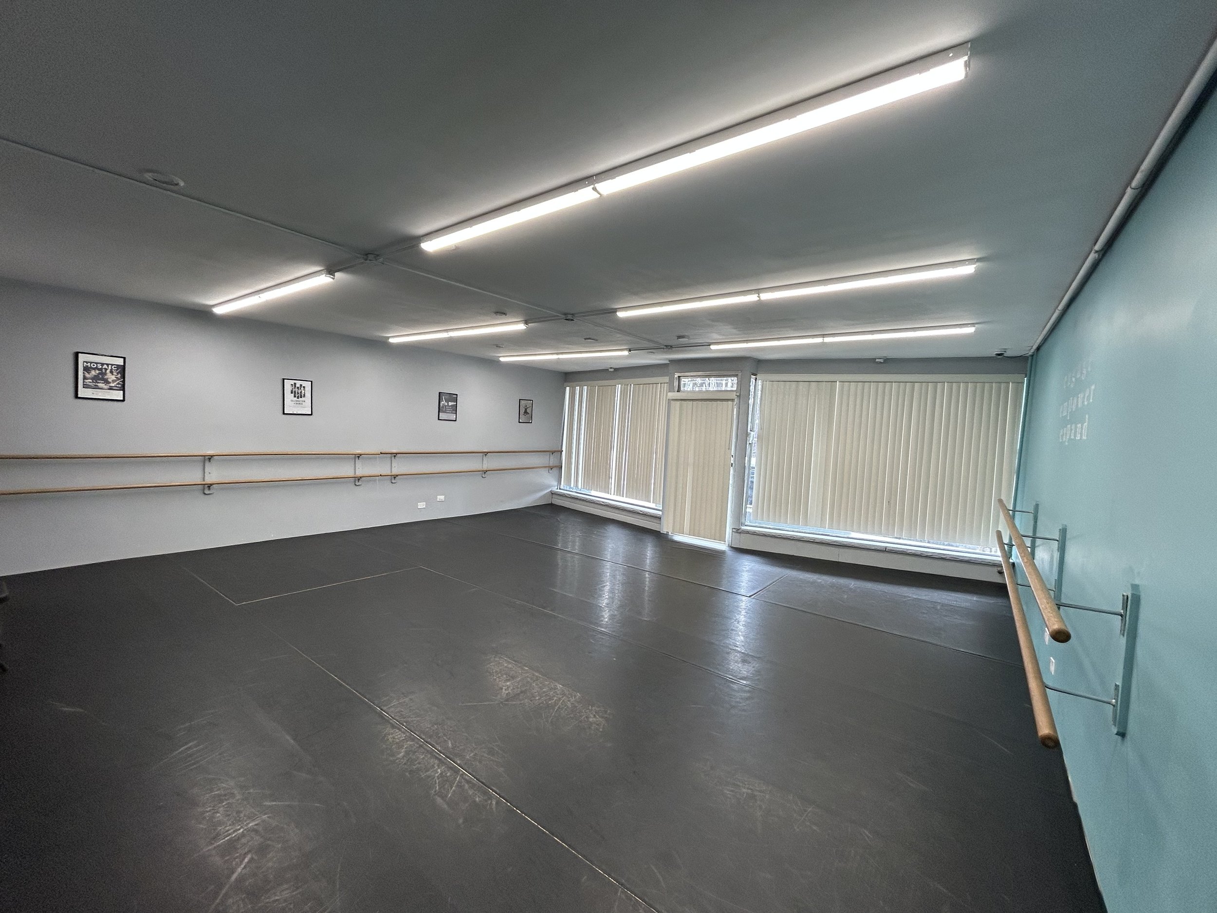 625 sq ft (25’x25’) | black marley floors | two wall of barres | one wall of large windows and natural light | stereo system |