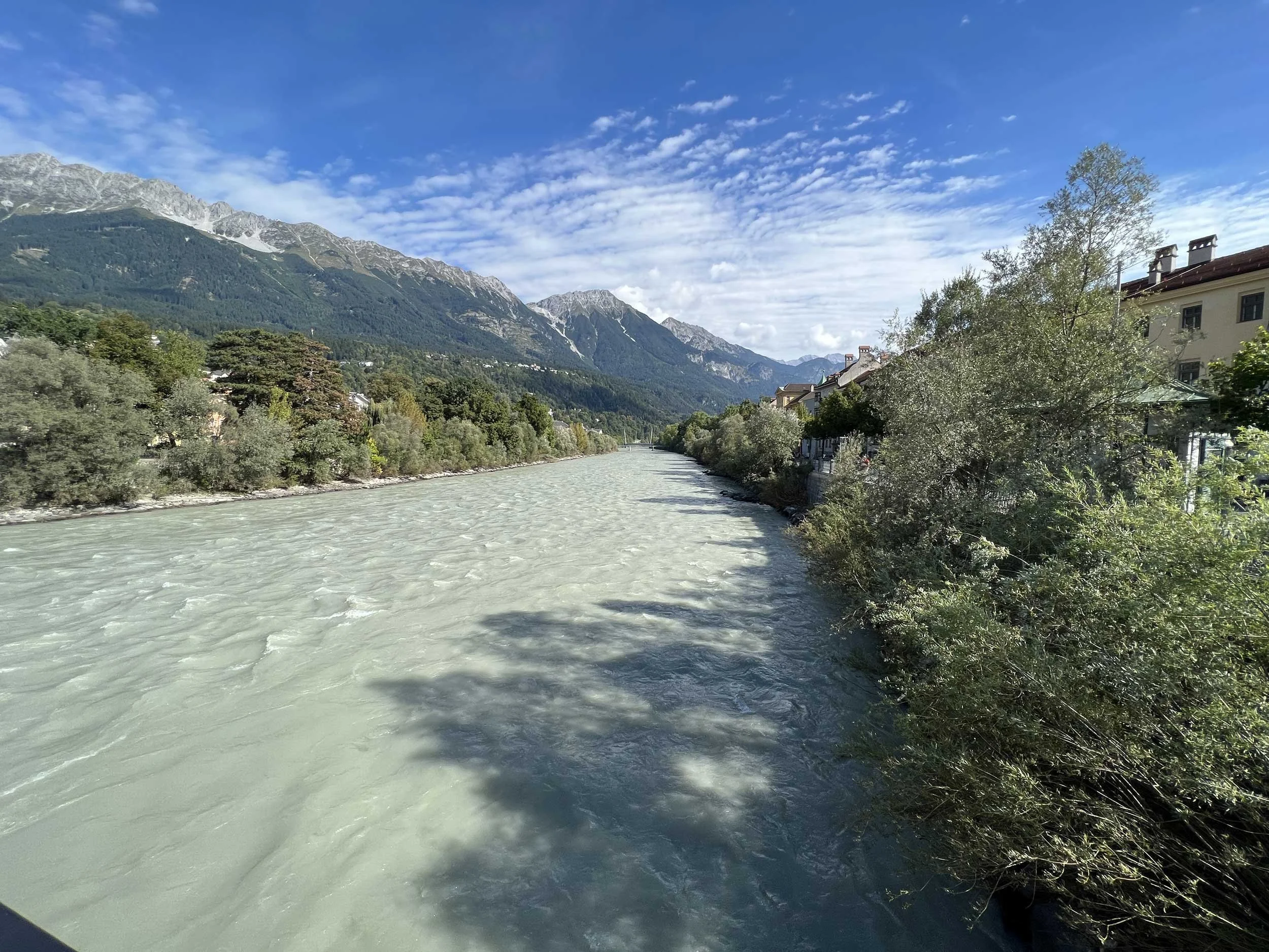The Color of the Inn River flowing through Innsbruck is known for it's blue-green color, which is common in alpine rivers.