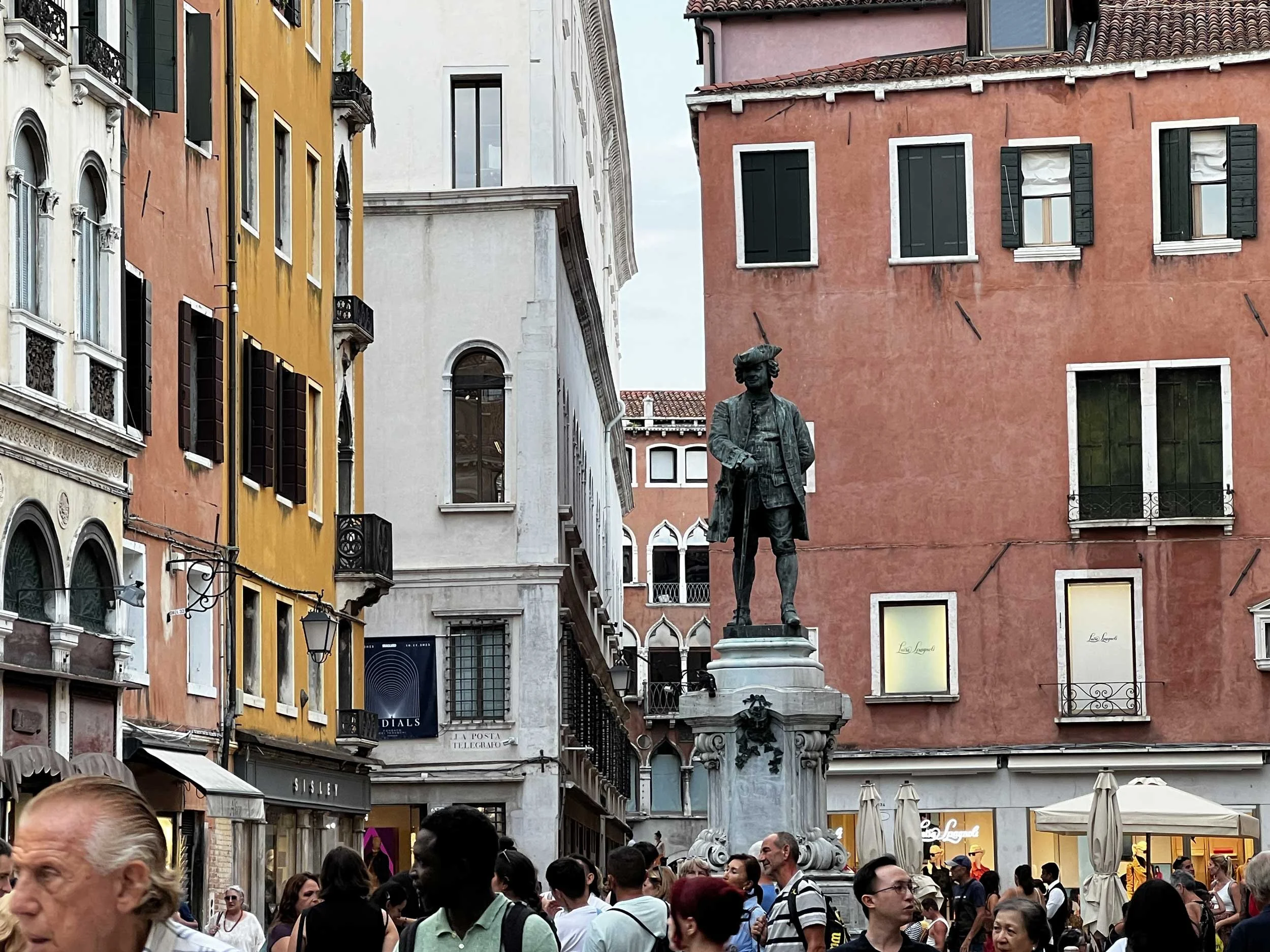 Statue and people near St. Mark's Square