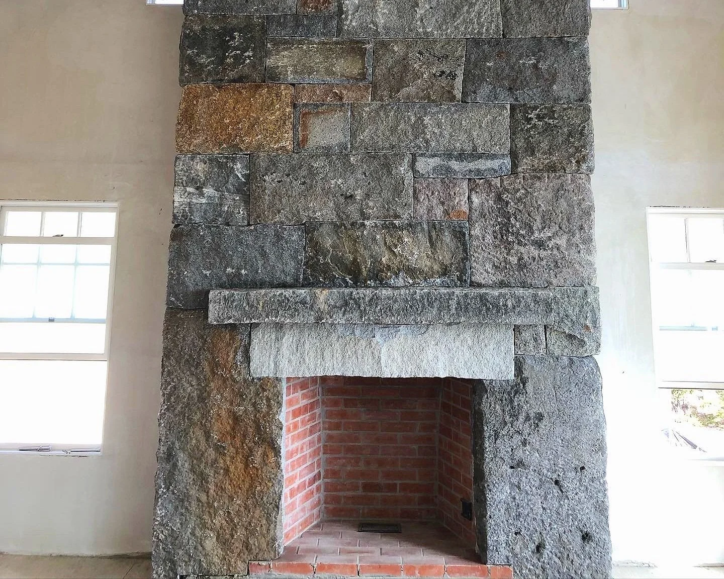 Granite fireplace with Rob Farone. Westport, MA